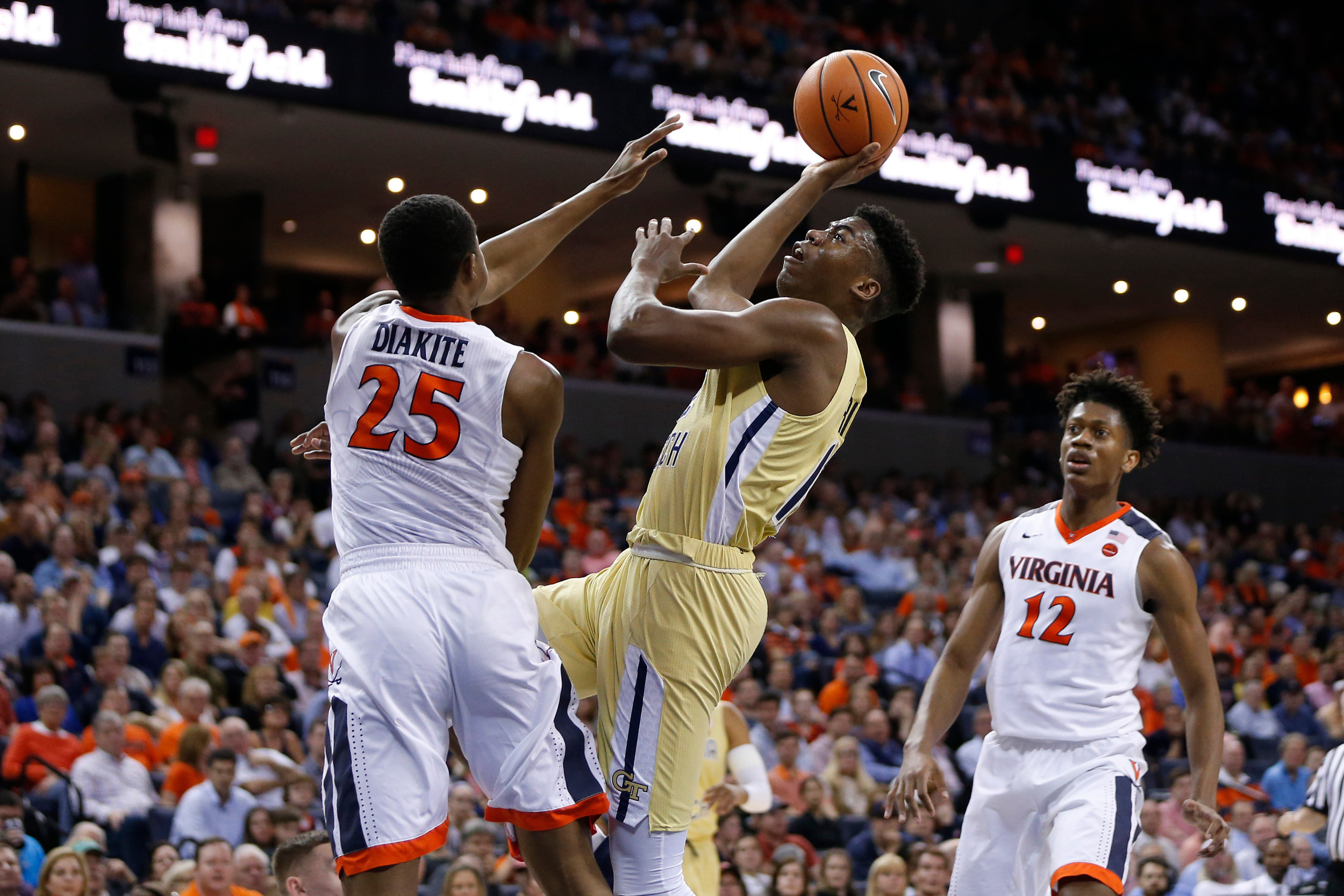 Feb 21, 2018; Charlottesville, VA, USA; Georgia Tech Yellow Jackets forward Moses Wright (12) attempts to shoot the ball as Virginia Cavaliers forward Mamadi Diakite (25) defends in front of Cavaliers guard De'Andre Hunter (12) during the first half at John Paul Jones Arena. Mandatory Credit: Amber Searls-USA TODAY Sports