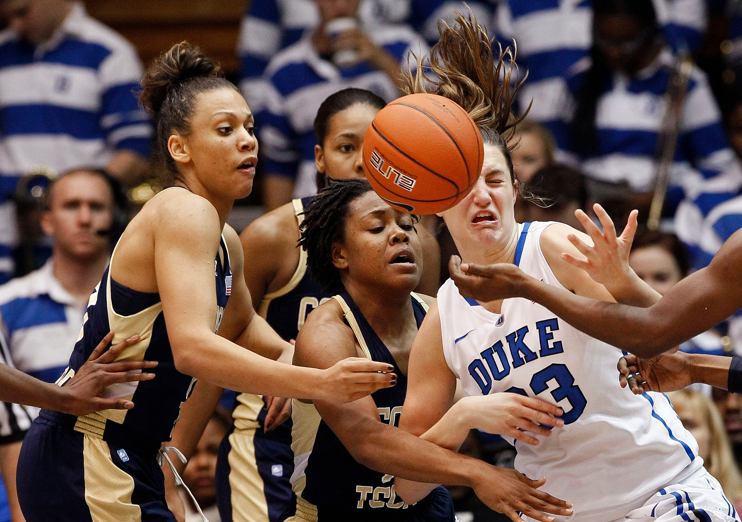 Duke's Haley Peters, right, struggles for a rebound against Georgia Tech's Danielle Hamilton-Carter, left, and Dawnn Maye during the second half of an NCAA women's college basketball game in Durham, N.C., Thursday, Dec. 6, 2012. Duke won 85-52. (AP Photo/Gerry Broome)