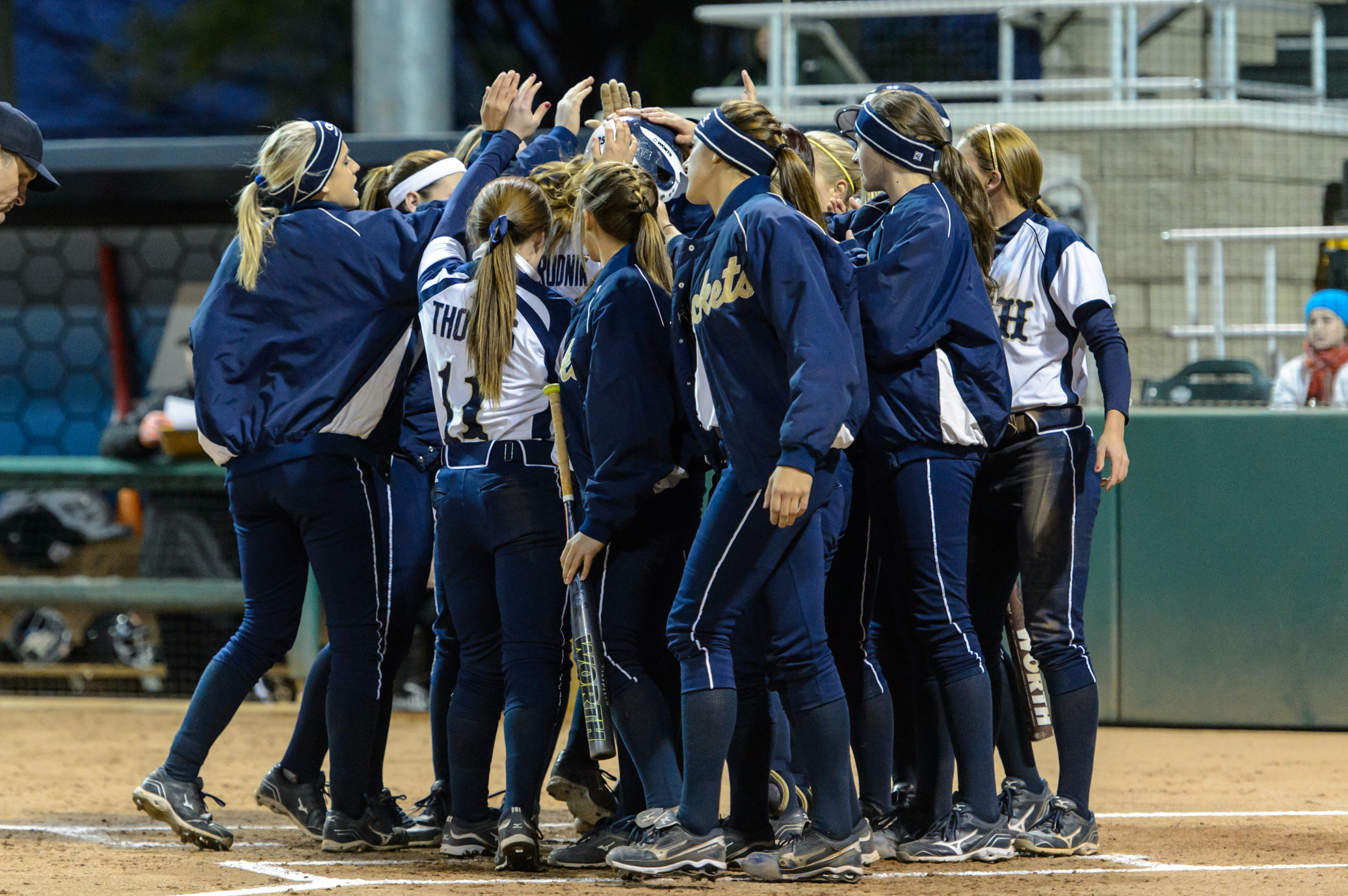 The team celebrates Alysha Rudnik's home run.