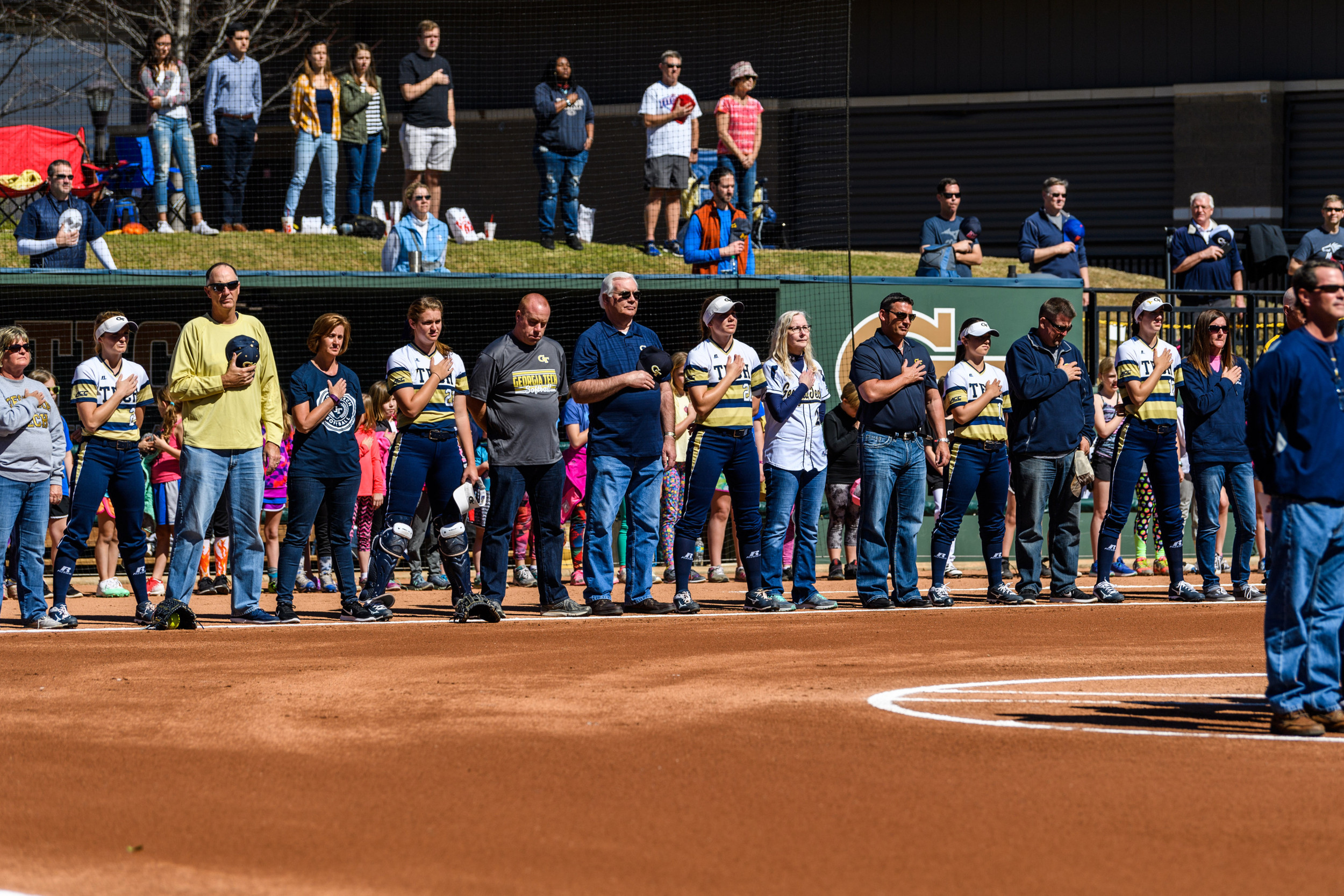 Players and their parents during the anthem
