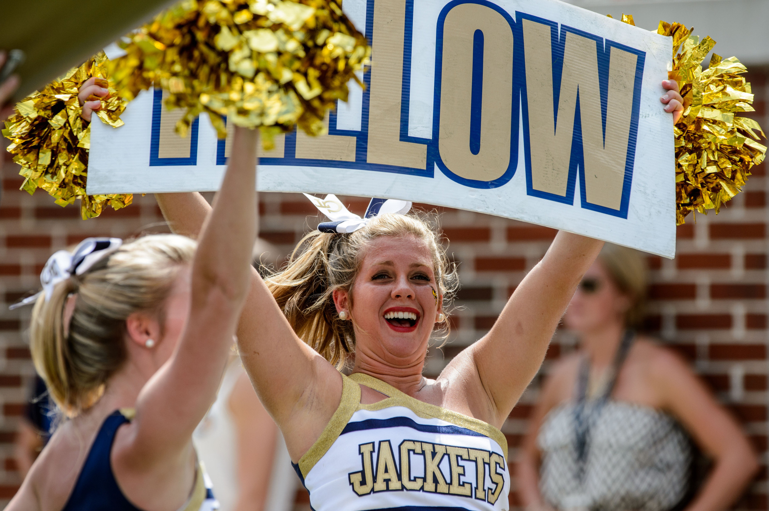A Georgia Tech cheerleader pumps up the crowd