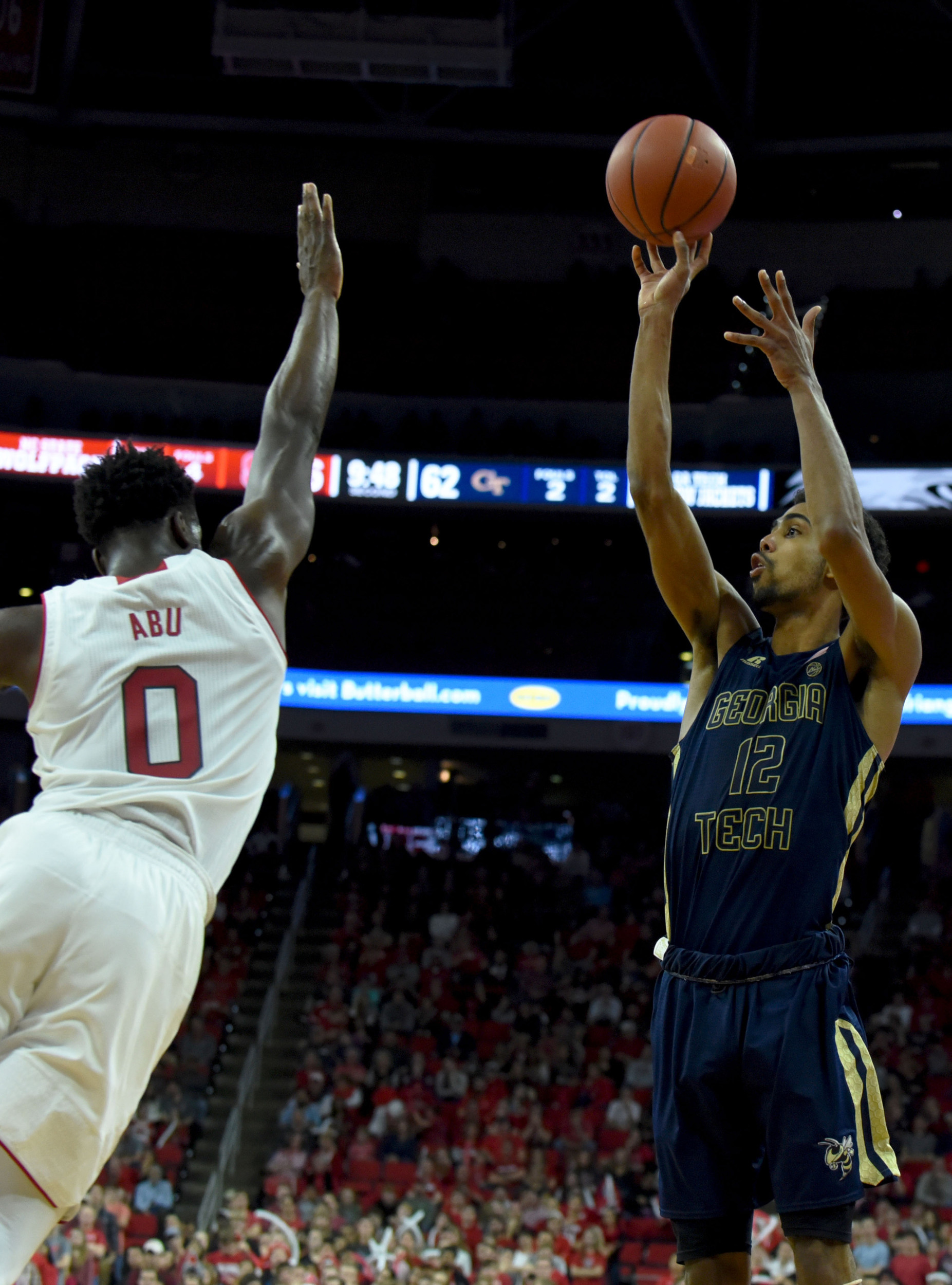 Forward Quinton Stephens shoots over North Carolina State Wolfpack forward Abdul-Malik Abu during the second half. The Yellow Jackets won 86-76. Credit: Rob Kinnan-USA TODAY Sports