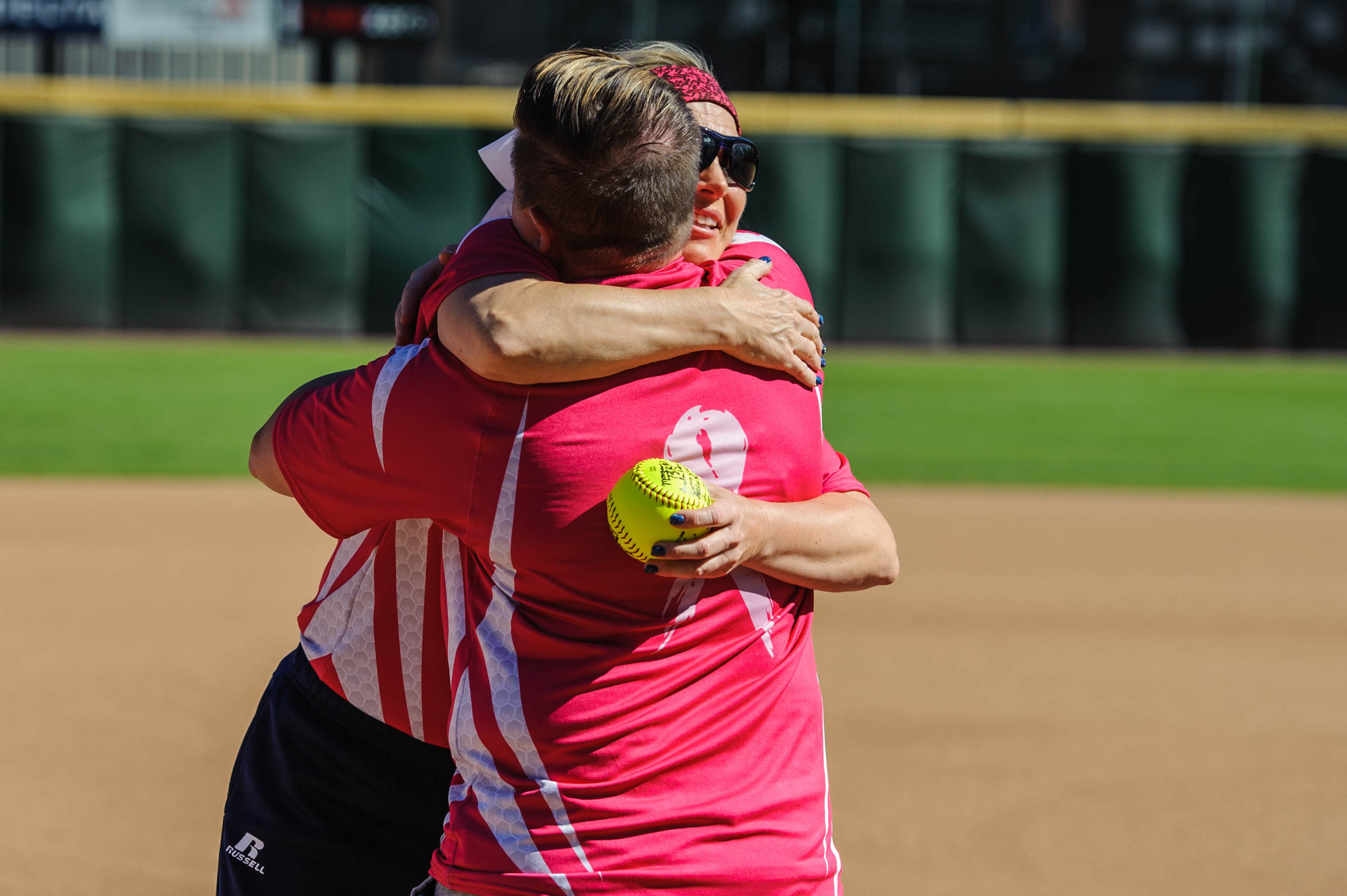Former Yellow Jacket and breast cancer survivor, Amy Hosier, hugs Coach Shelly Hoerner