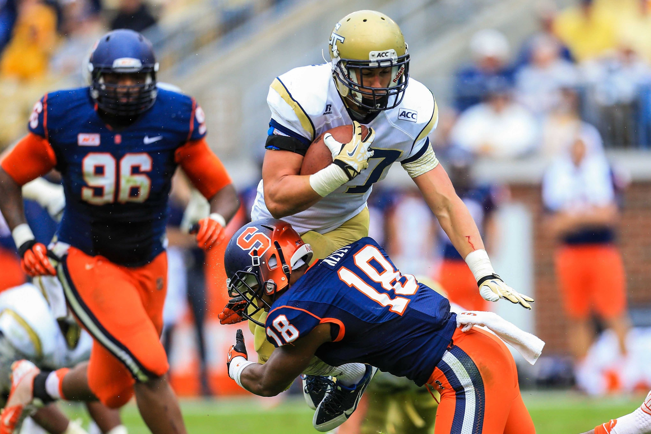 Zach Laskey (37) is tackled by Syracuse Orange defensive back Darius Kelly (18). Mandatory Credit: Daniel Shirey-USA TODAY Sports