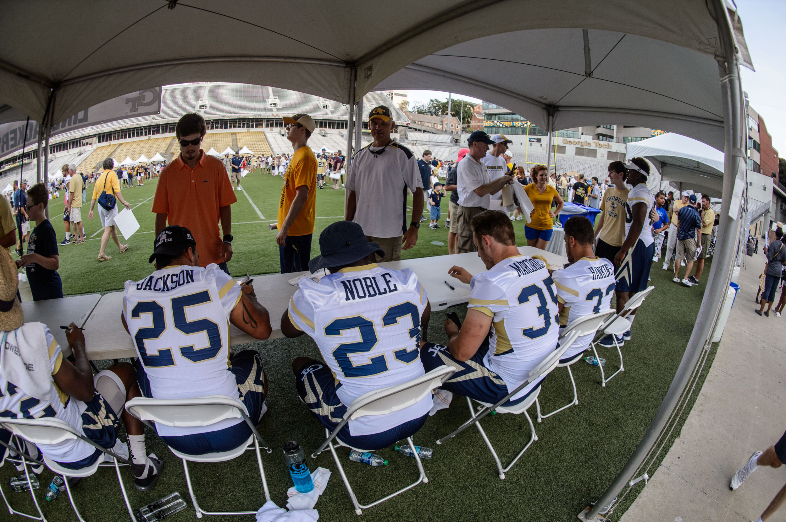 The linebackers sign autographs for fans