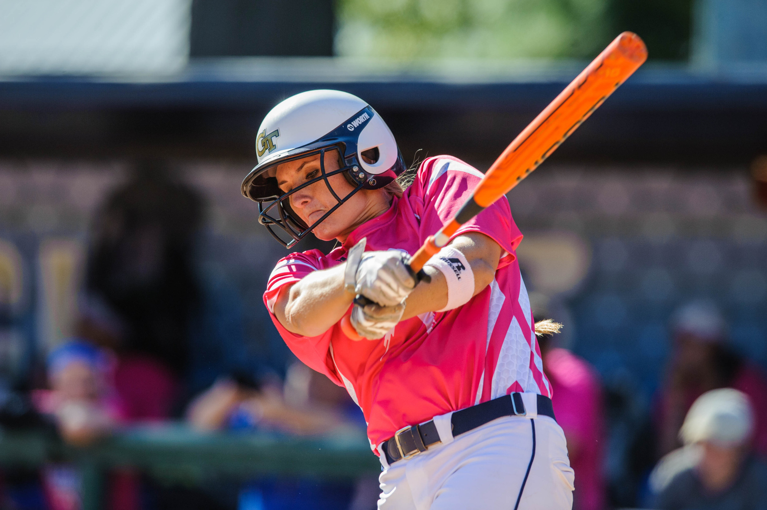 A Georgia Tech player swings for the ball.