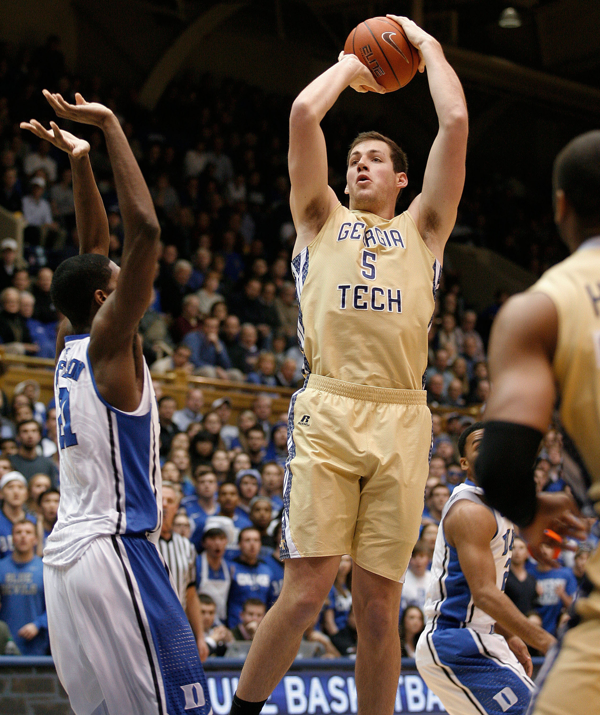Jan 7, 2014; Durham, NC, USA; Georgia Tech Yellow Jackets center Daniel Miller (5) shoots the ball over Duke Blue Devils forward Amile Jefferson (21) at Cameron Indoor Stadium. Mandatory Credit: Mark Dolejs-USA TODAY Sports