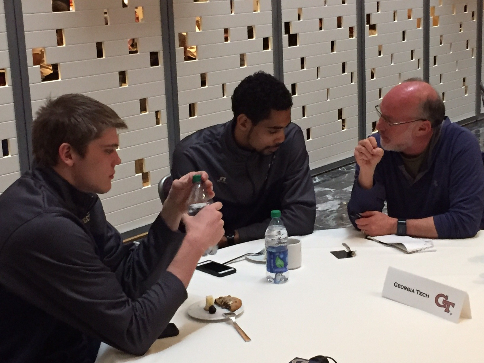 Ben Lammers and Quinton Stephens talk with AJC columnist Jeff Schultz at the Monday NIT media session.