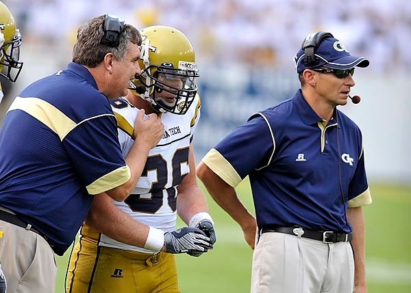 Head Coach Paul Johnson sends in a play with Lucas Cox (36). (Photo by LensEffects)
