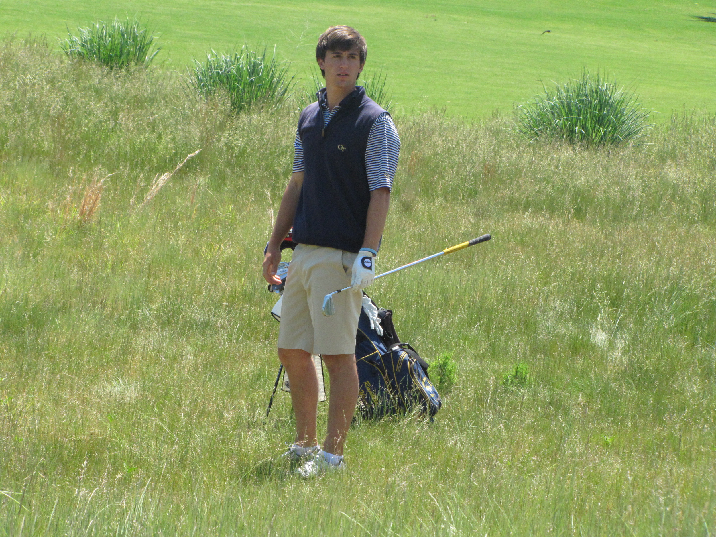 Ollie Schniederjans looks to head coach Bruce Heppler to find out where his second shot landed at the 9th hole of the final round of the NCAA Raleigh Regional.