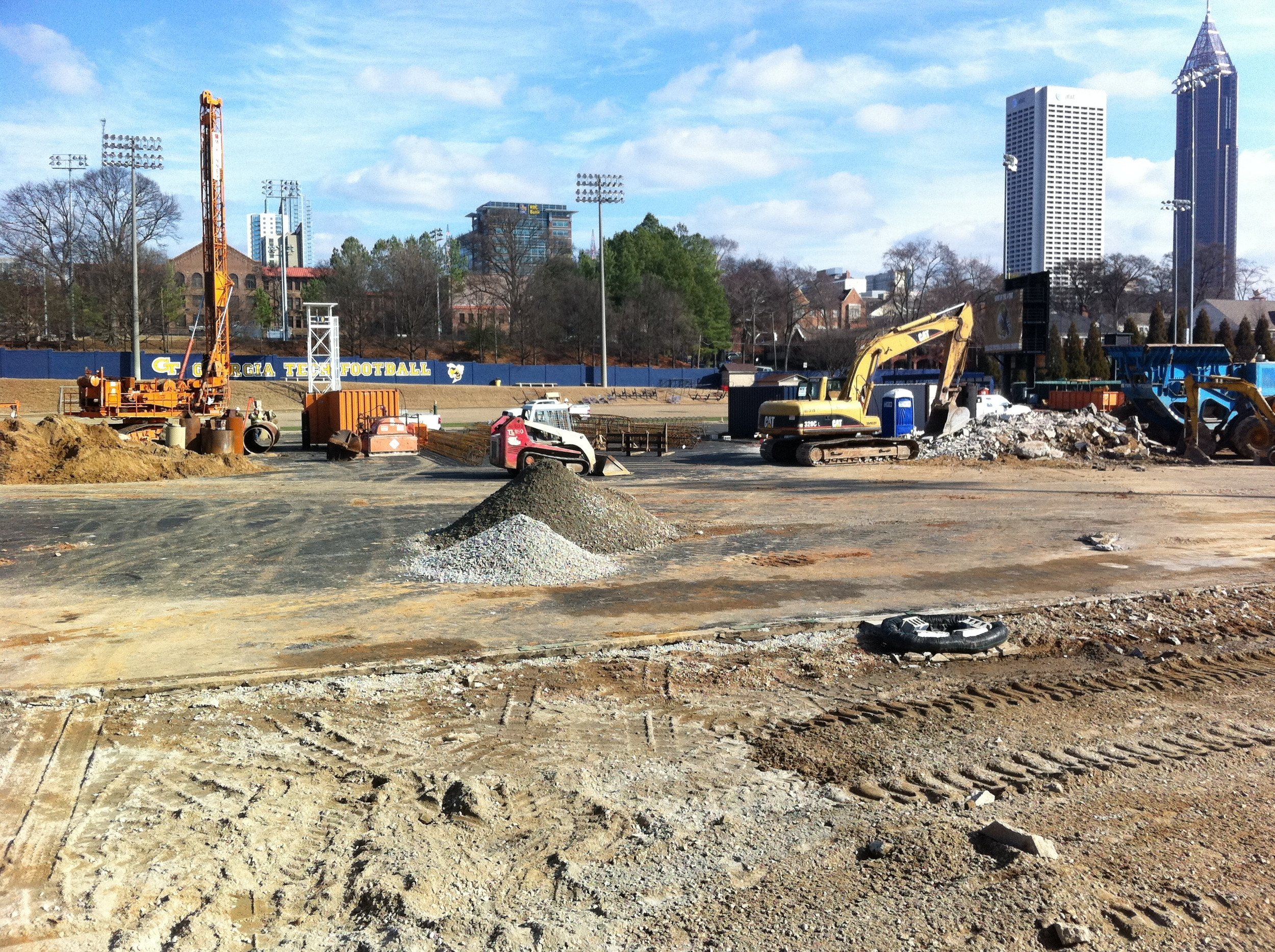 Week 6 - Photo taken on Feb. 10, 2011 - Barton Malow workers are drilling holes in the ground and are taking old concrete and recycling to use in this project.