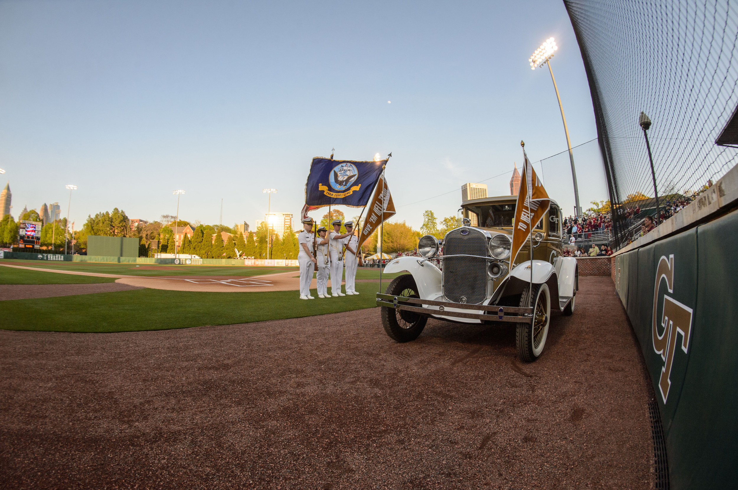 The Ramblin' Reck sits on the field at Russ Chandler Stadium as the Georgia Tech Navy ROTC presents the colors.