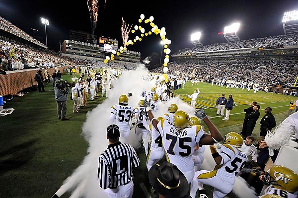 Georgia Tech players run onto the field. (Photo by Lenseffects)