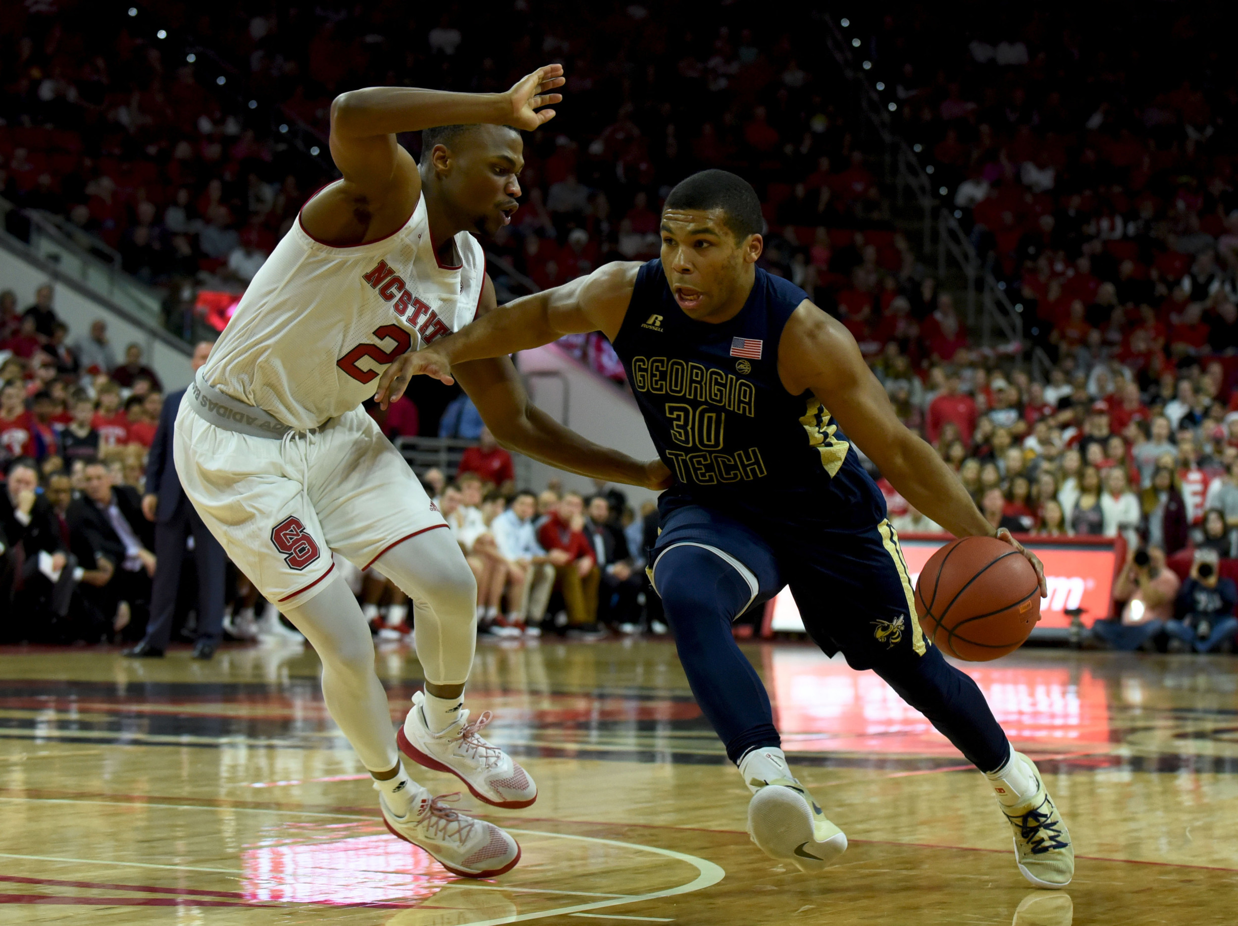 Guard Corey Heyward drives to the basket as North Carolina State Wolfpack guard Torin Dorn defends during the second half. The Yellow Jackets won 86-76. Credit: Rob Kinnan-USA TODAY Sports