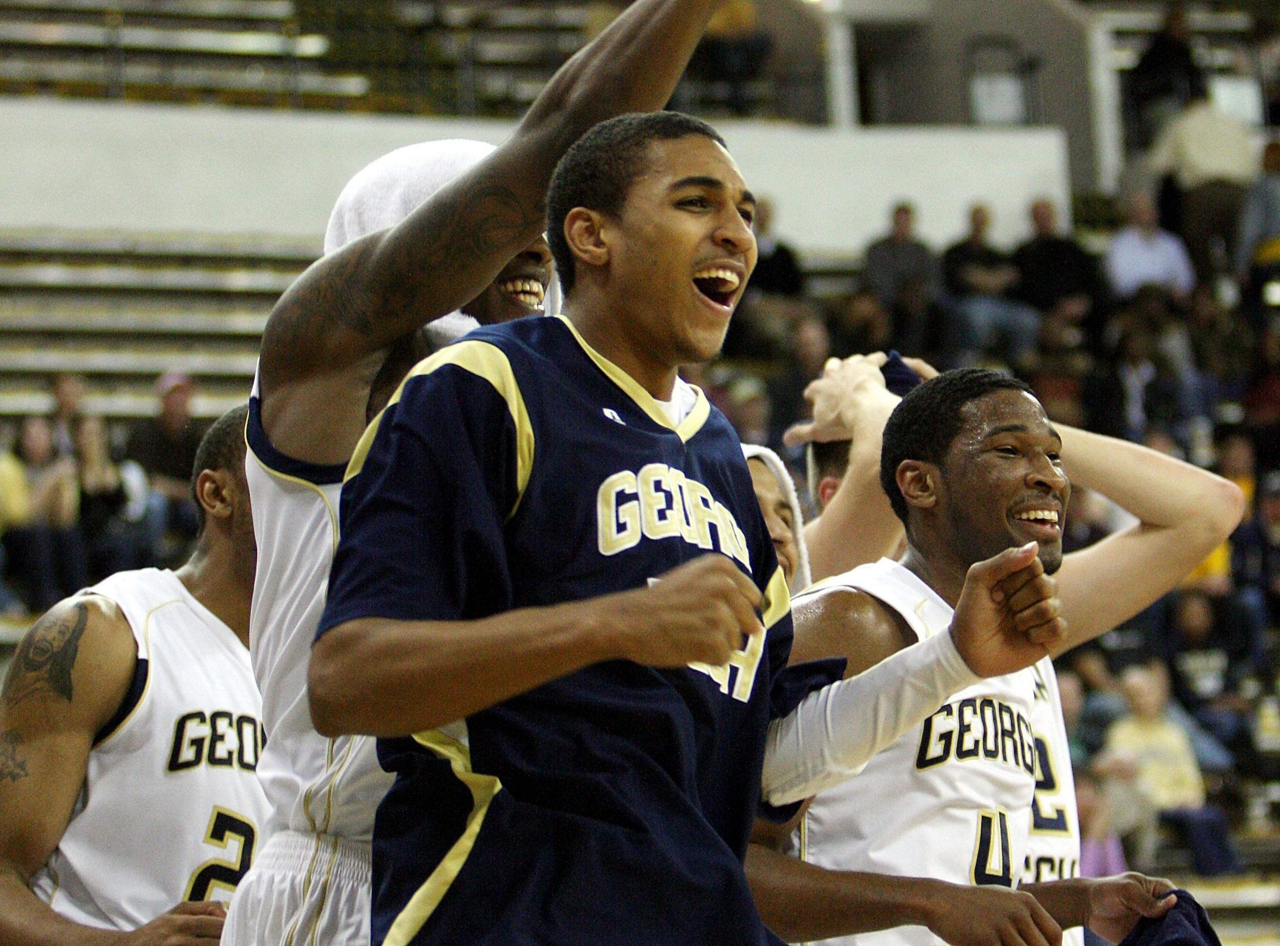 Georgia Tech Men's Basketball team celebrates on bench
