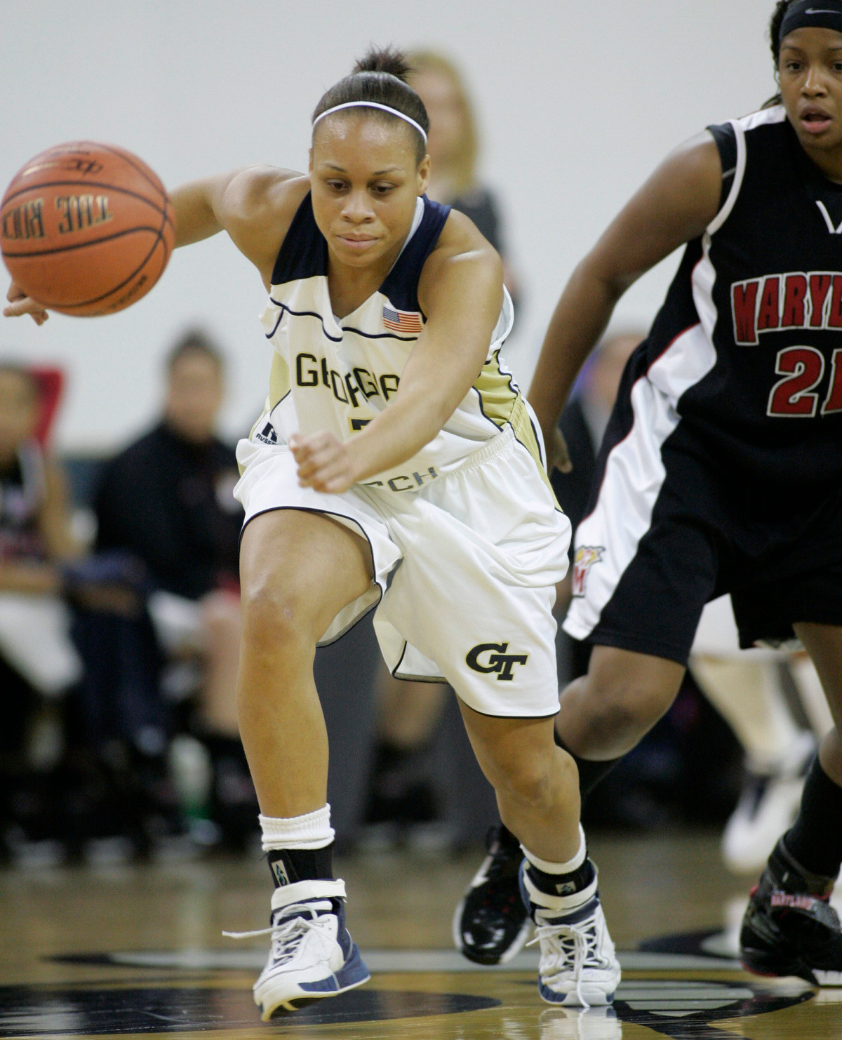 Georgia Tech guard Stephanie Higgs pursues a ball for one of her steals as Maryland guard Ashleigh Newman, right, looks on during the first half of their women's basketball game in Atlanta, Thursday, Febuary 1, 2007, in Atlanta. Higgs led all scorers in Georgia Tech's 77-72 win. (AP Photo/John Amis)