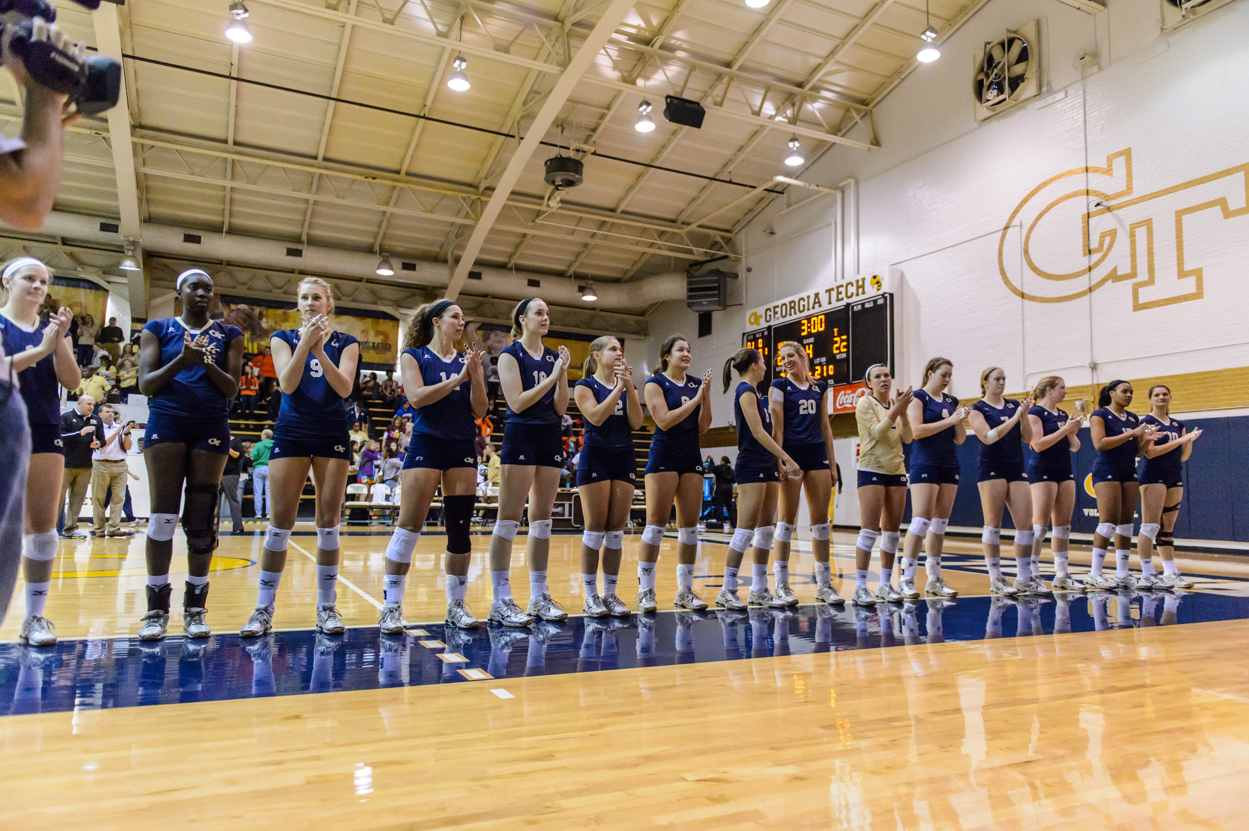The team sings the fight song after the win.