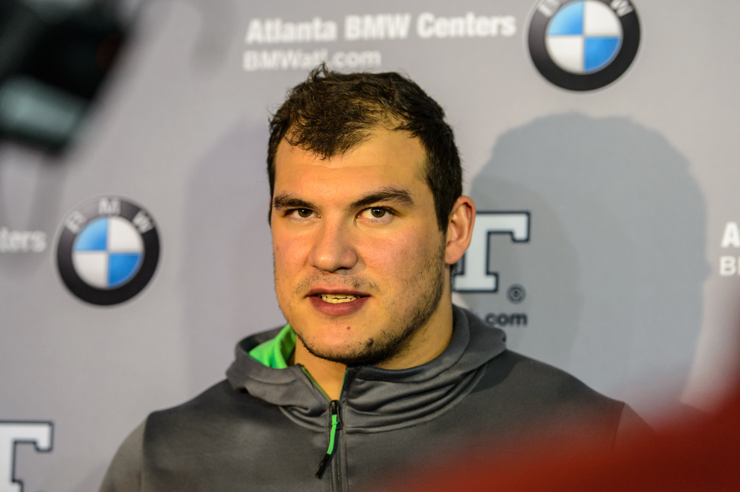 Adam Gotsis (96) talks with the media