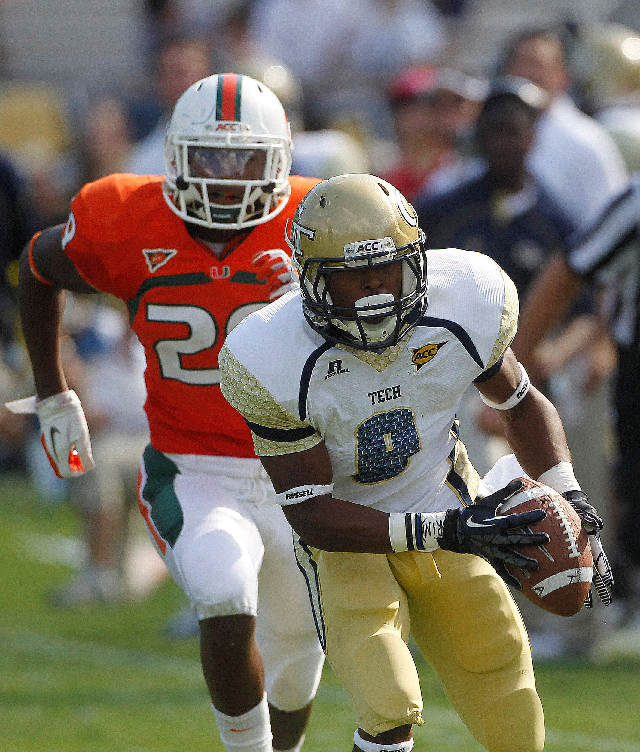 Georgia Tech running back Tony Zenon (9) makes a catch for big gain as Miami defensive back Rayshawn Jenkins (29) defends in the first half of an NCCA college football game in Atlanta on Saturday, Sept. 22, 2012. (AP Photo/John Bazemore)