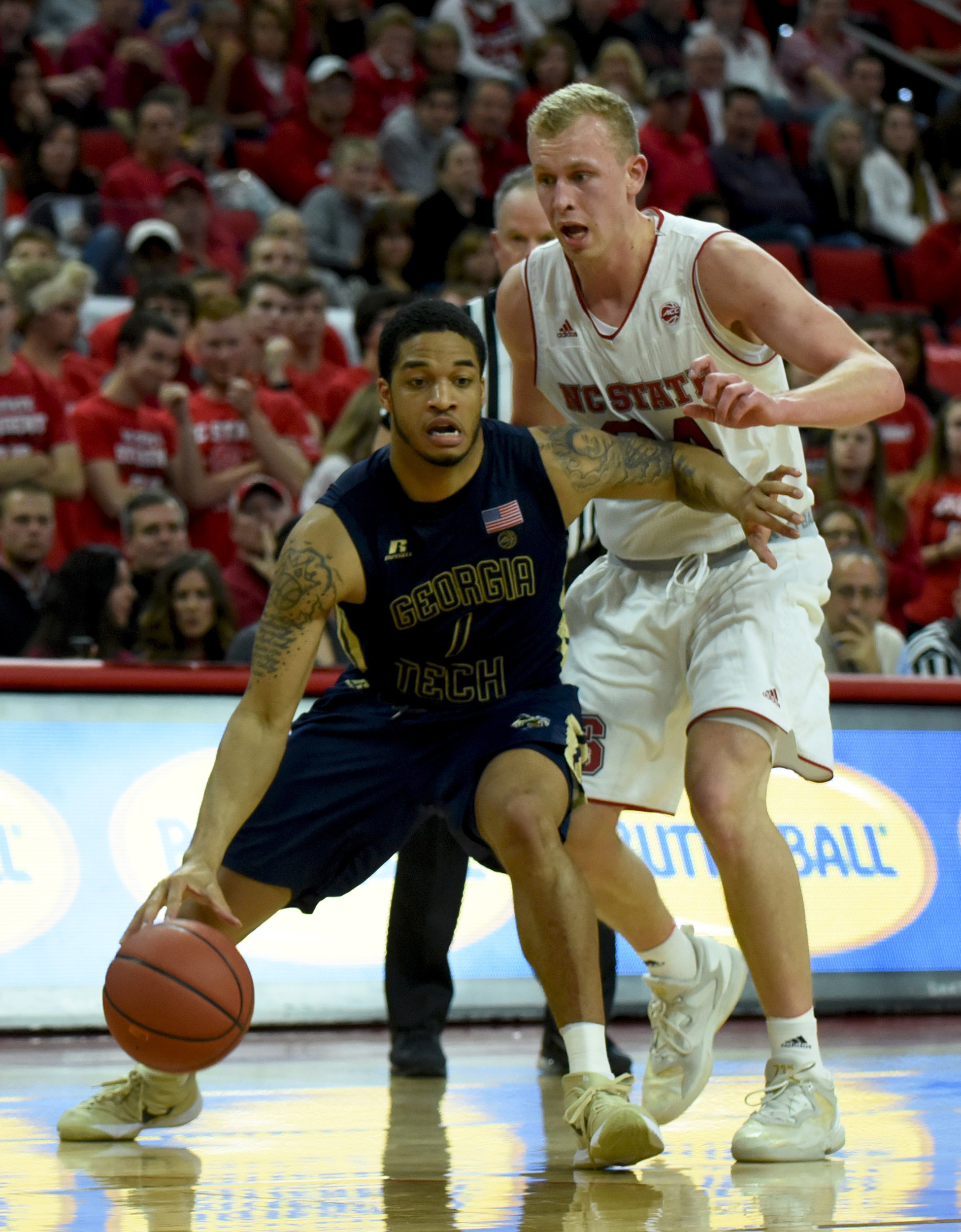 Guard Tadric Jackson drives to the basket as North Carolina State Wolfpack guard Maverick Rowan defends during the second half. The Yellow Jackets won 86-76. Credit: Rob Kinnan-USA TODAY Sports
