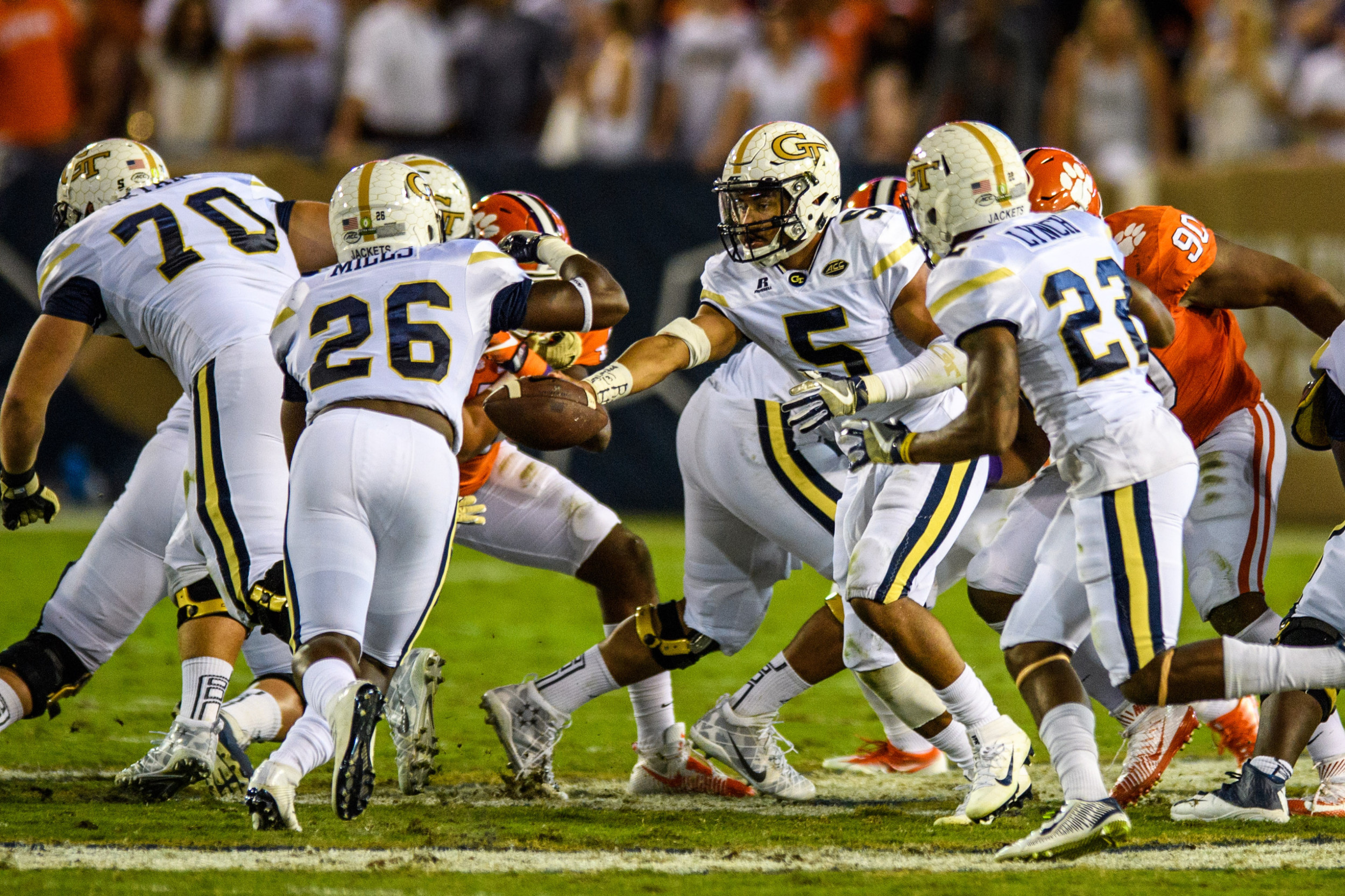Justin Thomas (5), Dedrick Mills (26) execute a handoff in the first half of the game versus No. 5 Clemson on Sept. 22, 2016.