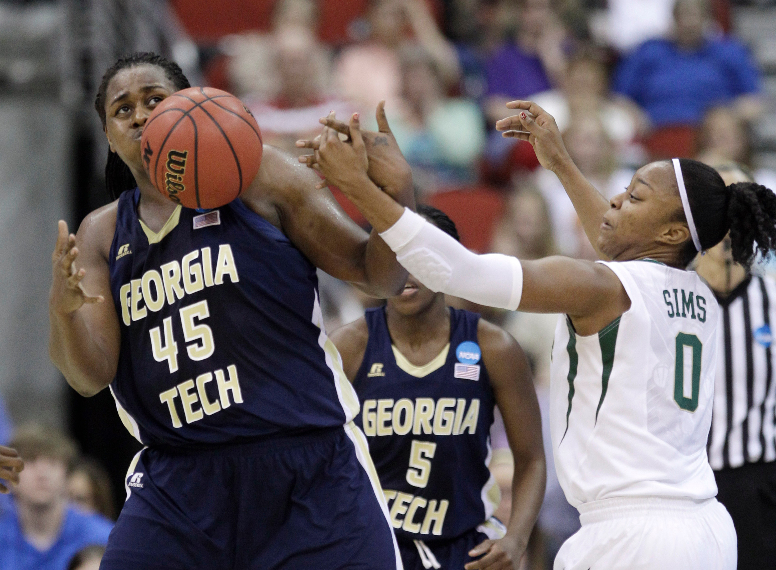 Georgia Tech center Sasha Goodlett (45) fights for a loose ball with Baylor guard Odyssey Sims during the first half. (AP Photo/Charlie Neibergall)
