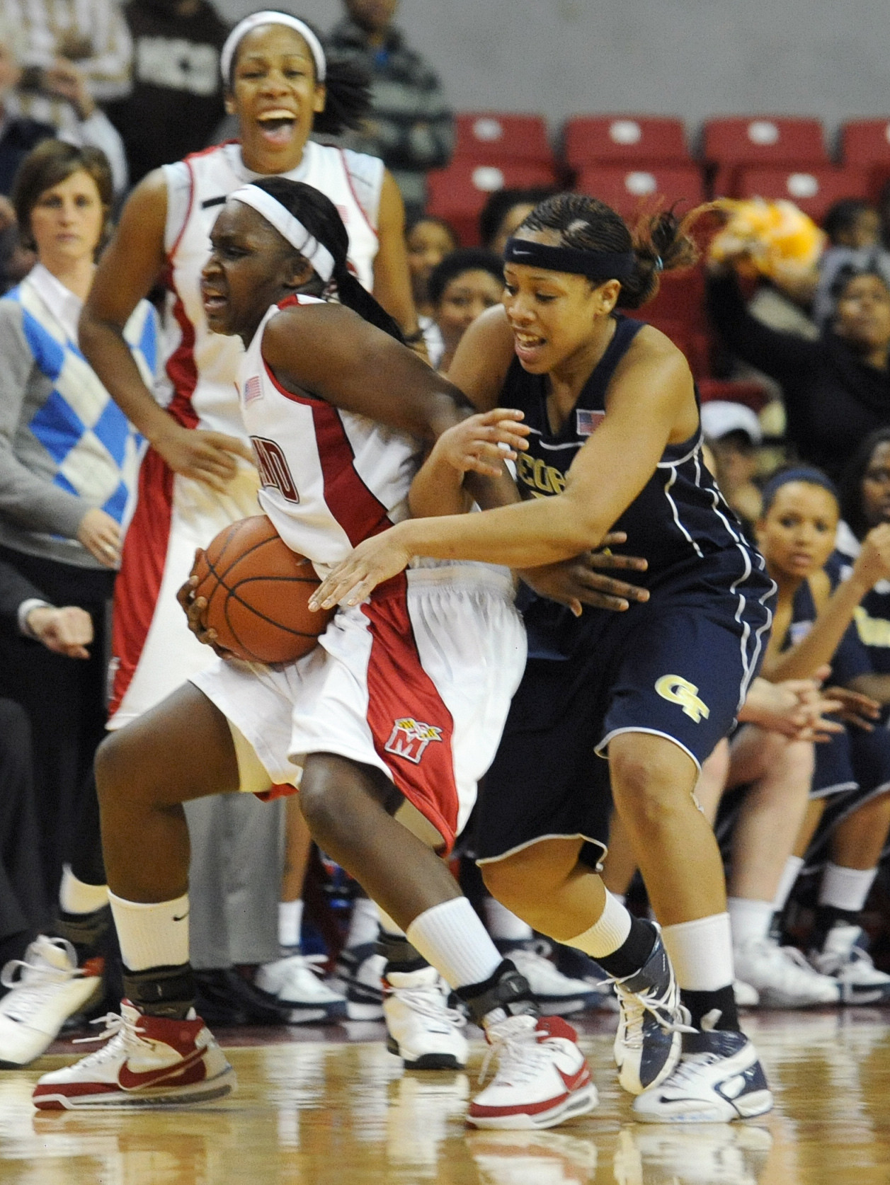 Maryland's Crystal Langhorne is fouled after stealing the ball by Georgia Tech's Iasia Hemingway during the first overtime. (AP Photo/Gail Burton)