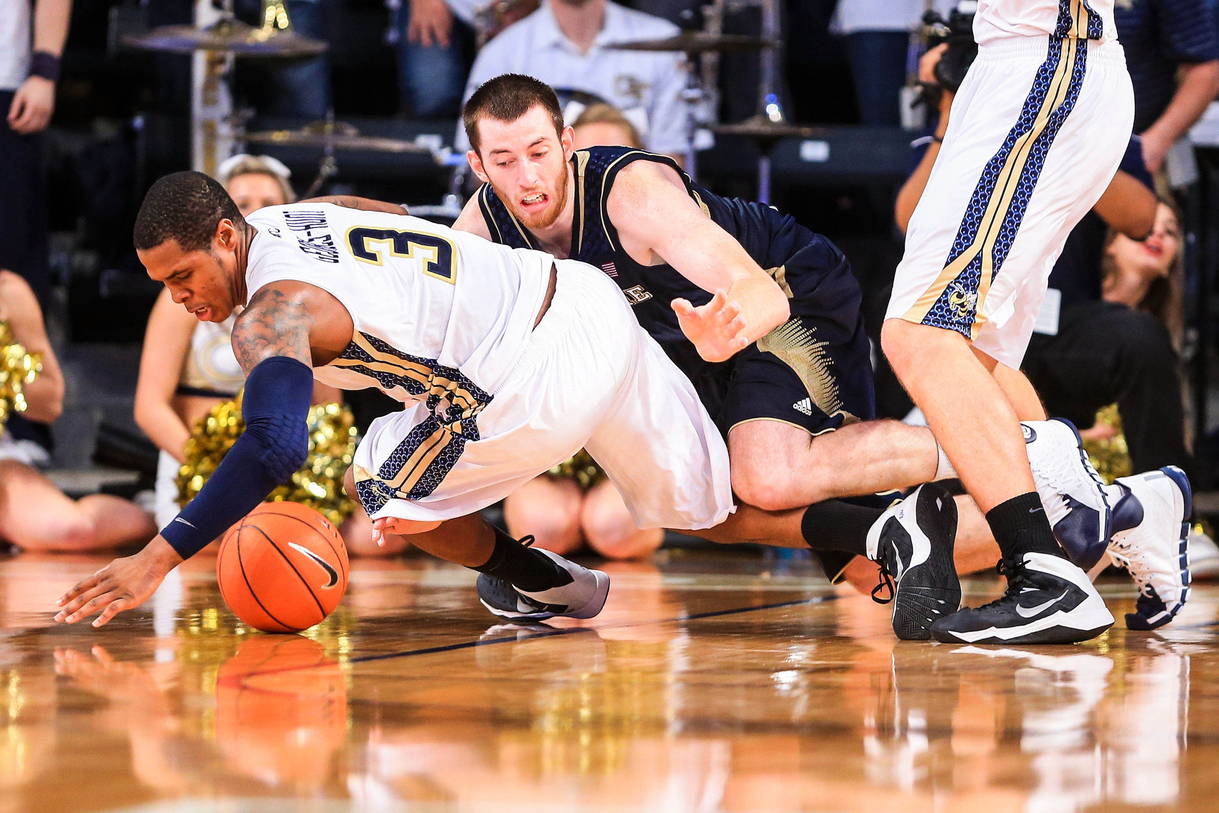 Jan 11, 2014; Atlanta, GA, USA; Notre Dame Fighting Irish center Garrick Sherman (11) and Georgia Tech Yellow Jackets forward Marcus Georges-Hunt (3) battle for a loose ball in the second half at Hank McCamish Pavilion. Georgia Tech won 74-69. Mandatory Credit: Daniel Shirey-USA TODAY Sports