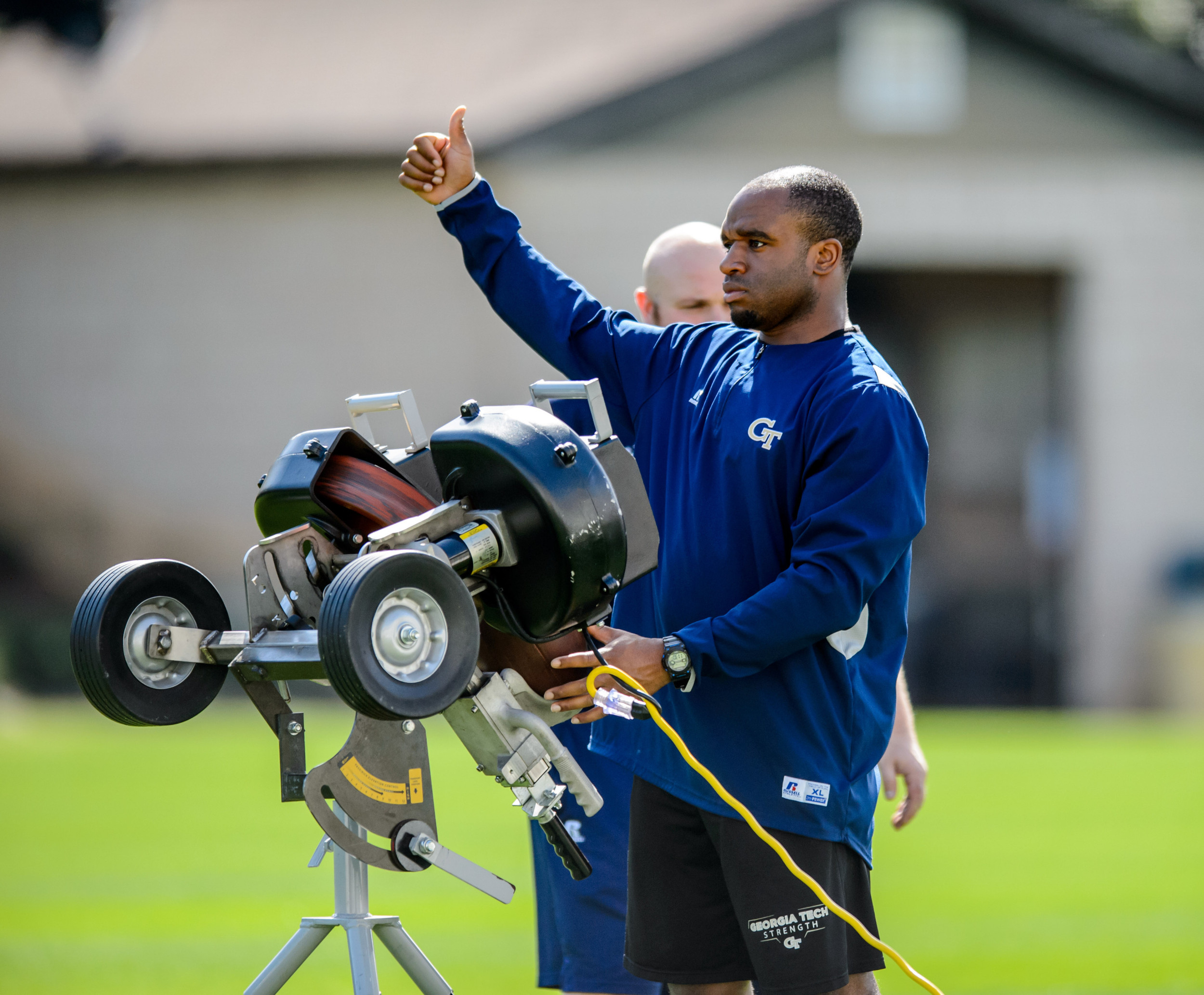 Players prepare to receive punts outside