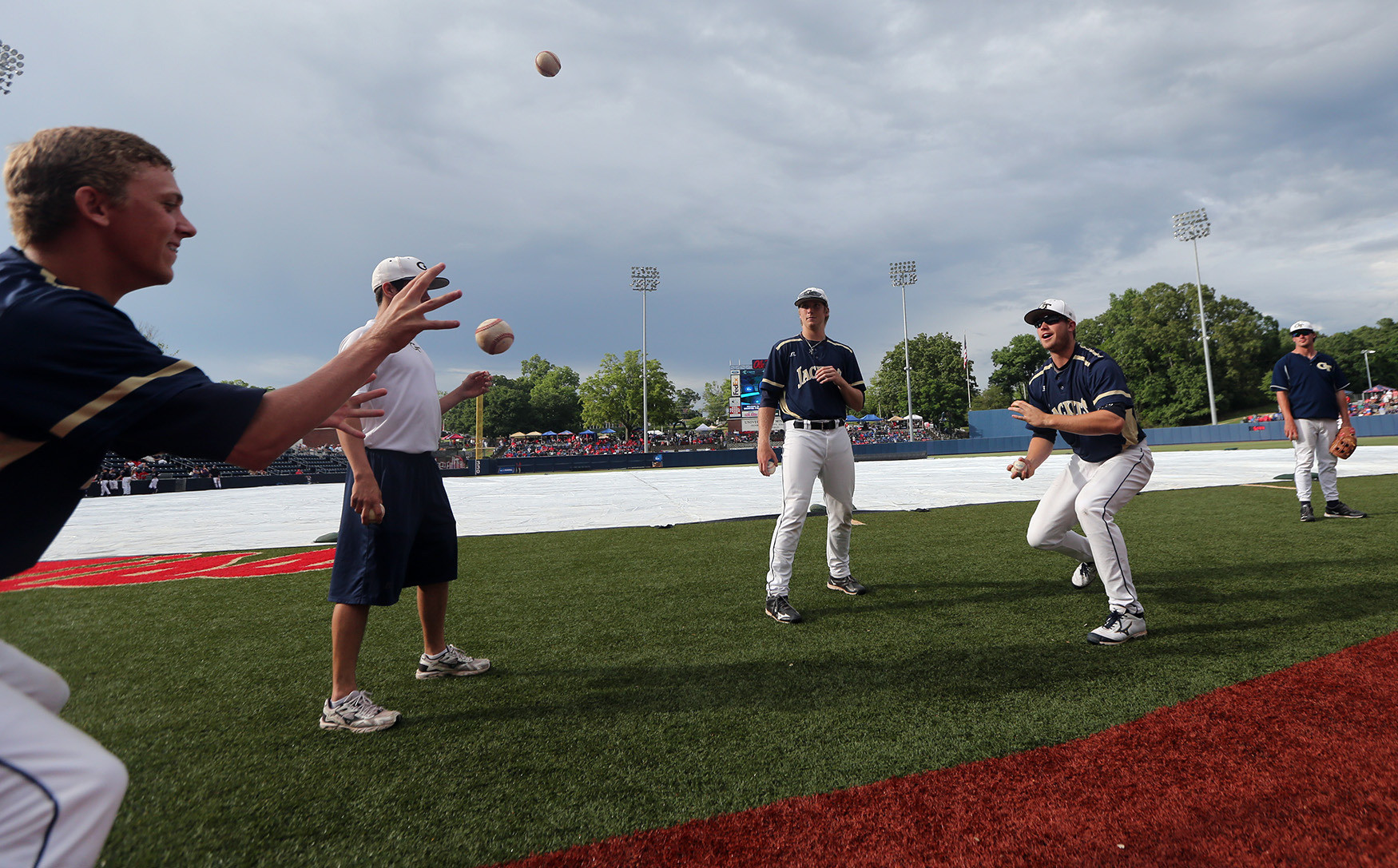 Georgia Tech players keep entertained during the rain delay. (Photo by Josh McCoy)