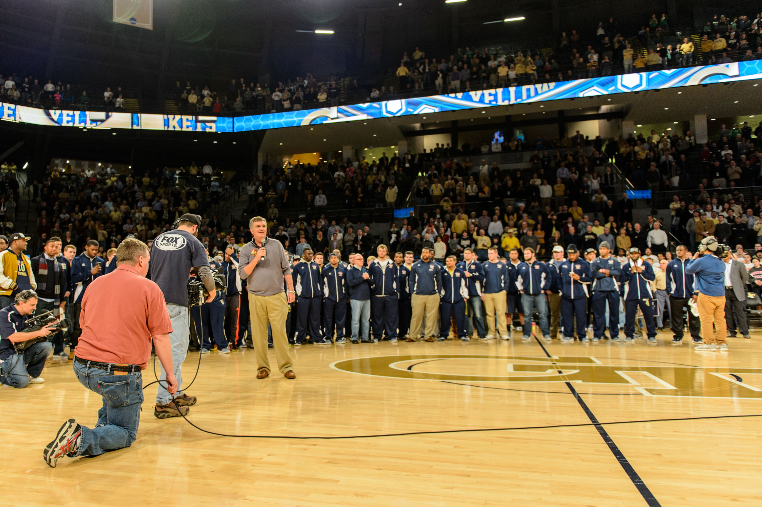 Coach Paul Johnson speaks to the crowd at halftime as the Orange Bowl Champion Yellow Jackets were honored
