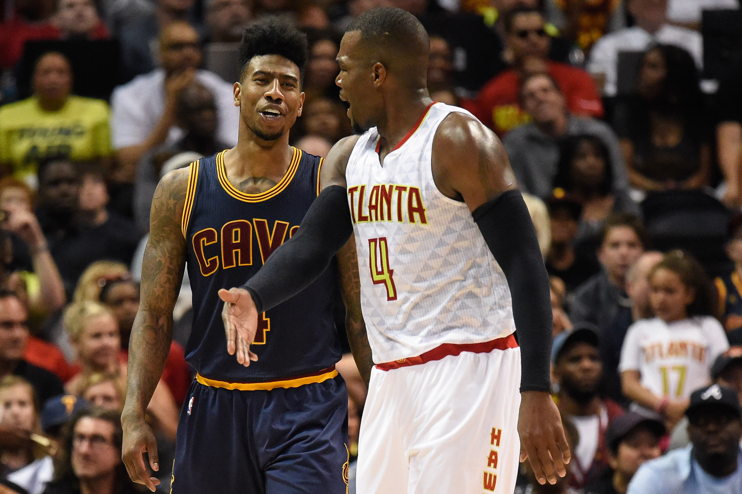 May 8, 2016; Atlanta, GA, USA; Cleveland Cavaliers guard Iman Shumpert (4) and Atlanta Hawks forward Paul Millsap (4) exchange words during game four of the second round of the NBA Playoffs. The Cavaliers won the game 100-99. Credit: Dale Zanine-USA TODAY Sports