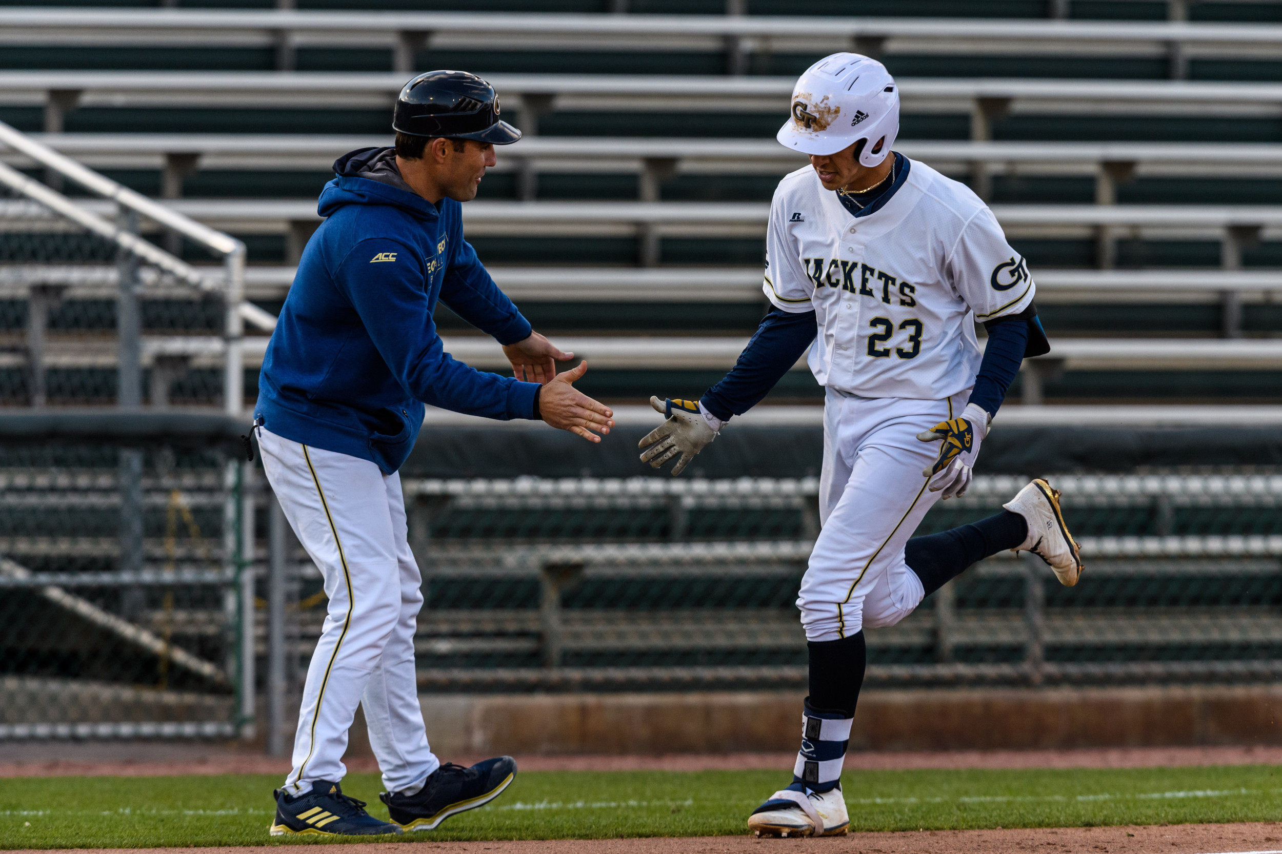 Assistant Coach Mike Nickeas (12), Oscar Serratos (23)