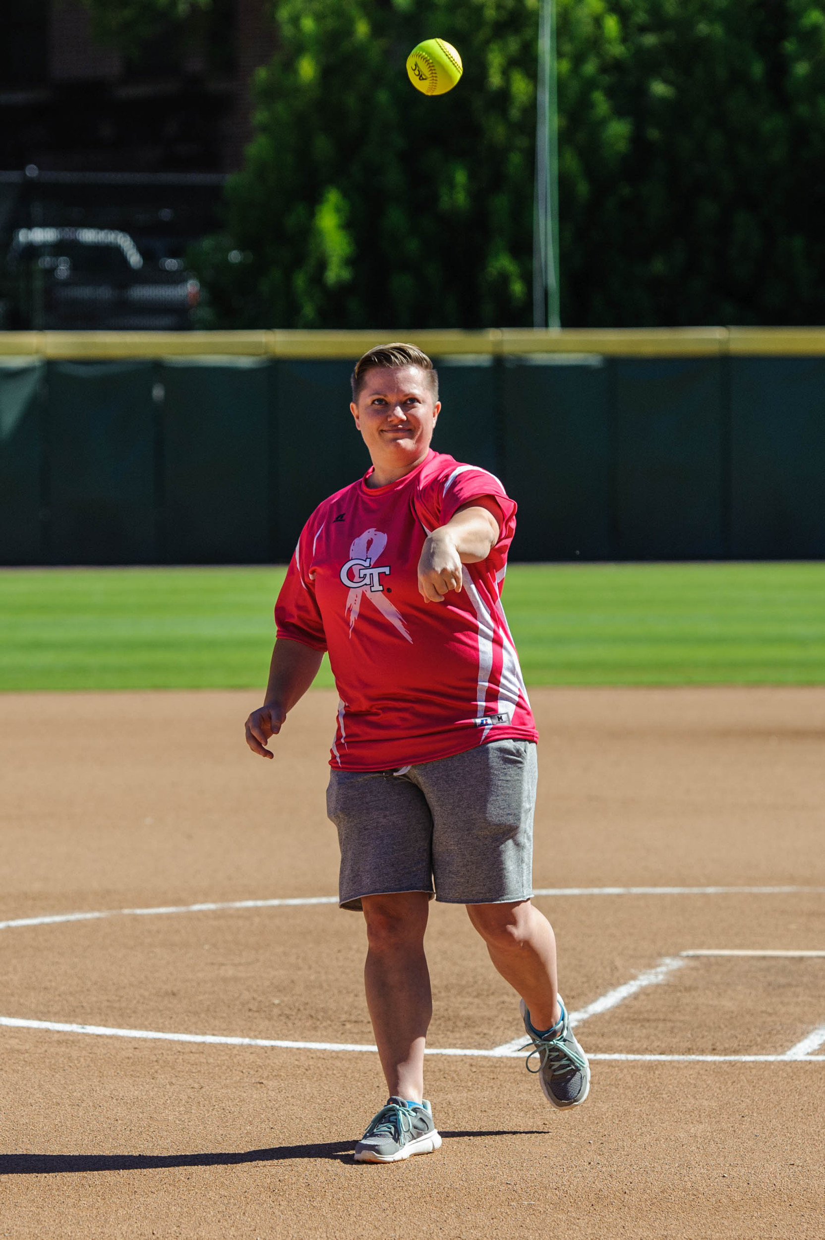 Former Yellow Jacket and breast cancer survivor, Amy Hosier, throws the first pitch.