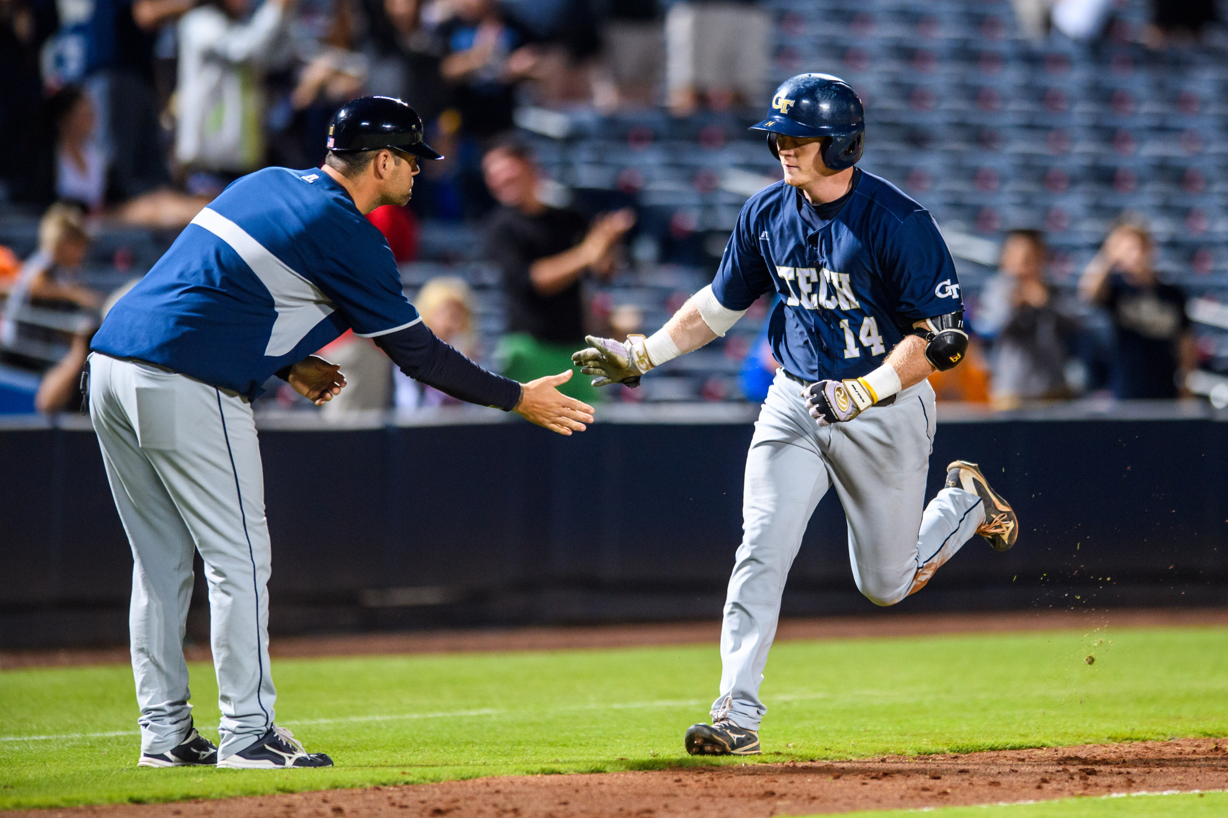Matt Gonzalez (14), Assistant Coach Bryan Prince (18)