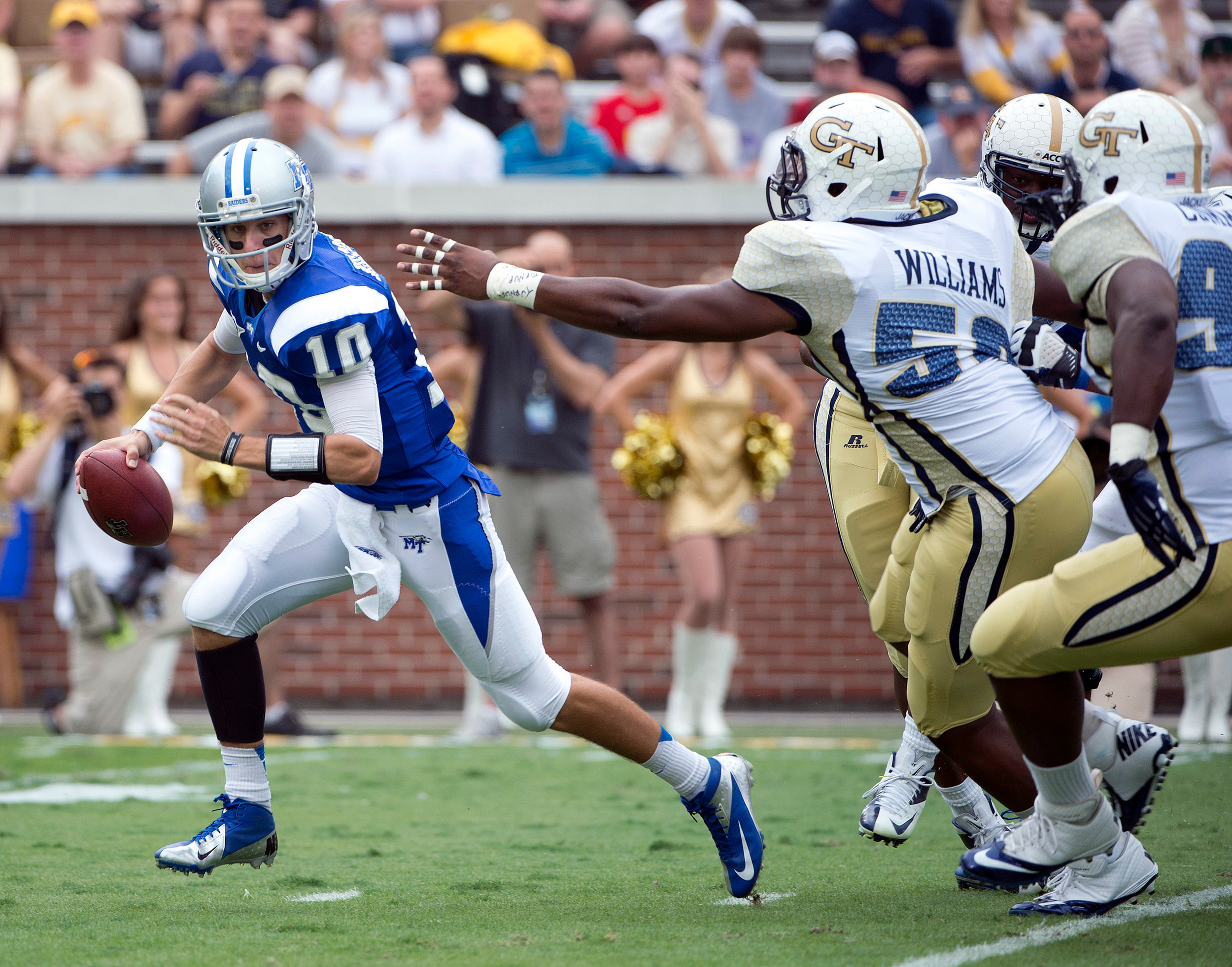 Georgia Tech defensive end Anthony Williams pursues Middle Tennessee State quarterback Logan Kilgore. (AP Photo/Rich Addicks)