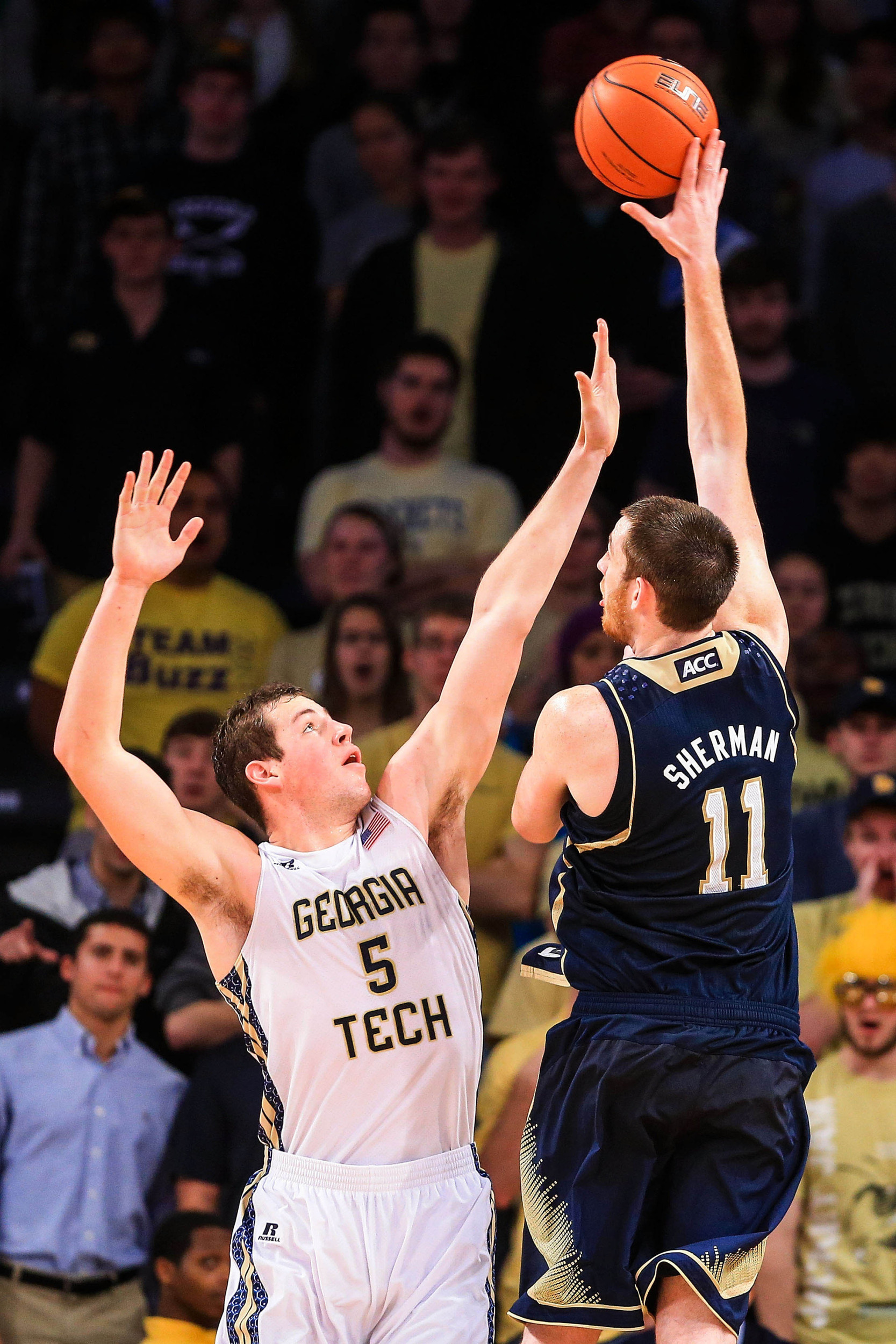 Jan 11, 2014; Atlanta, GA, USA; Notre Dame Fighting Irish center Garrick Sherman (11) shoots a basket over Georgia Tech Yellow Jackets center Daniel Miller (5) in the second half at Hank McCamish Pavilion. Georgia Tech won 74-69. Mandatory Credit: Daniel Shirey-USA TODAY Sports