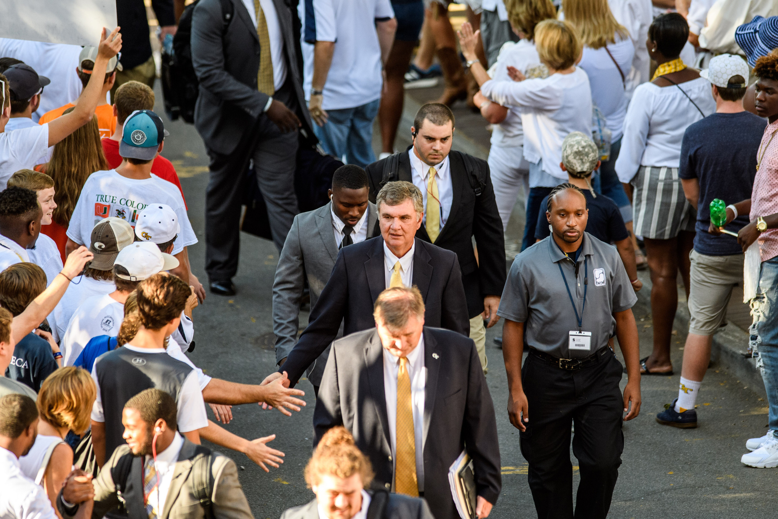 Coach Paul Johnson walks down Yellow Jacket Alley