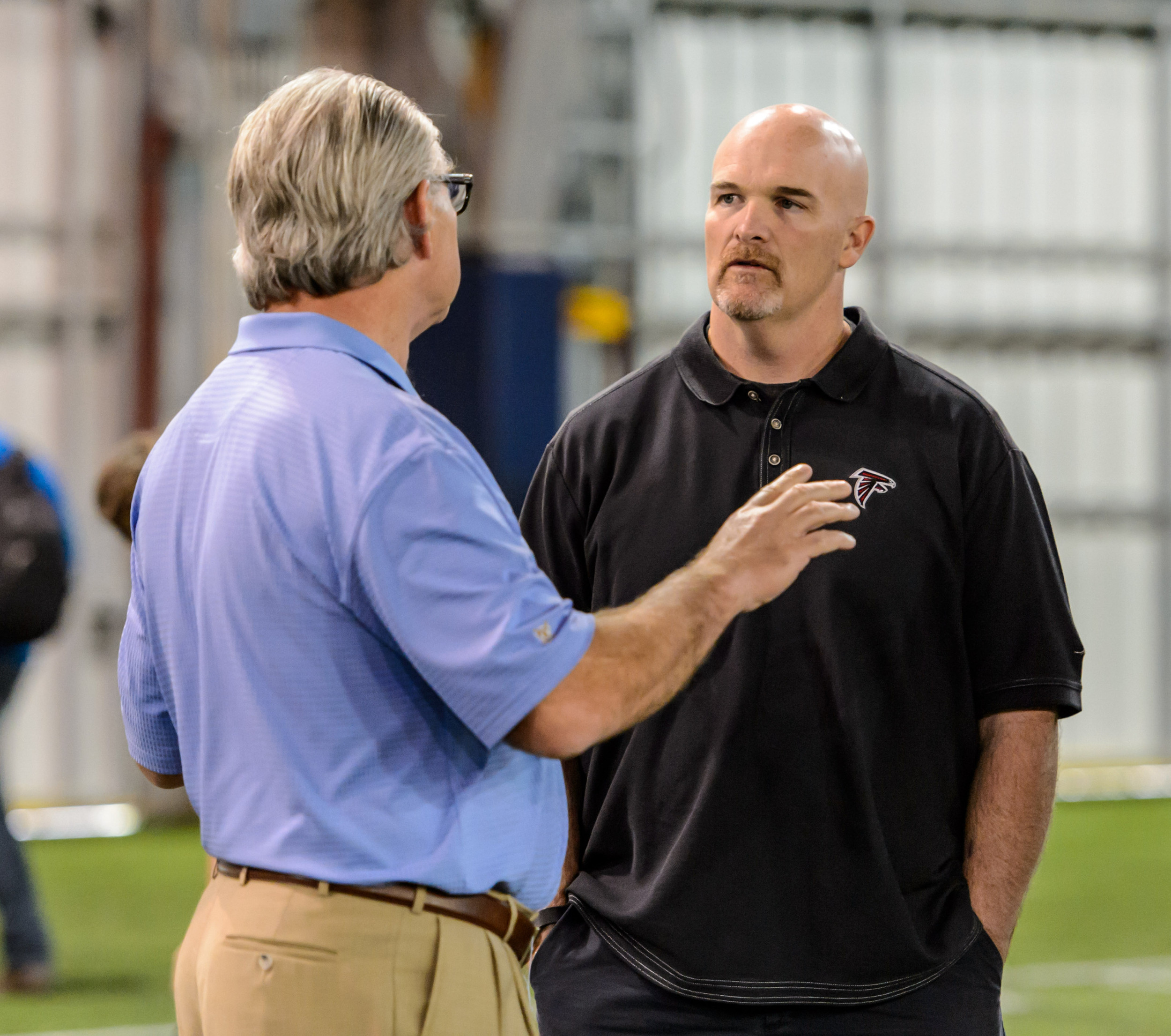 Defensive Coordinator Ted Roof talks to Head Coach Dan Quinn of the Atlanta Falcons