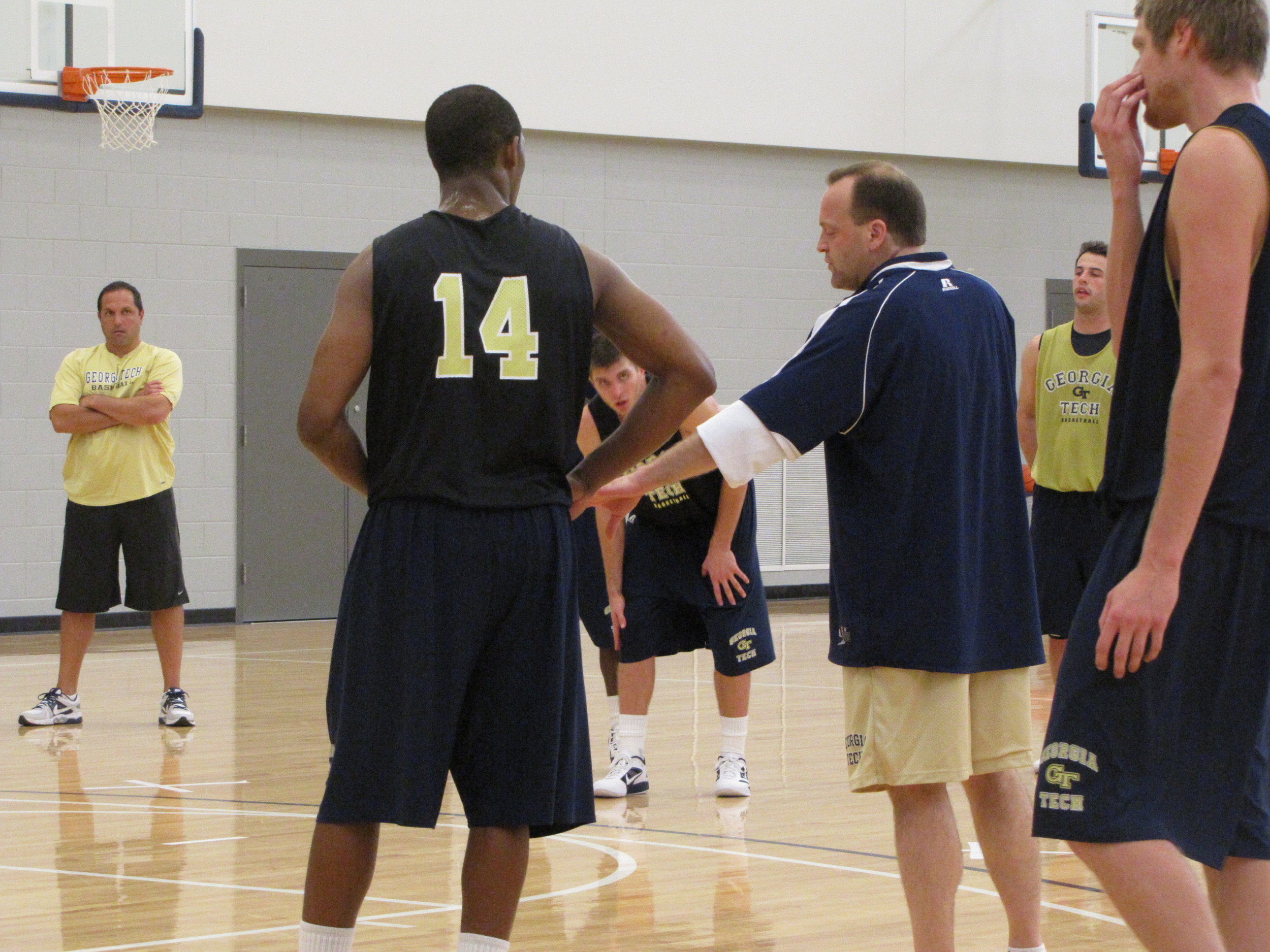 Assistant coach Billy Schmidt instructs Jason Morris.