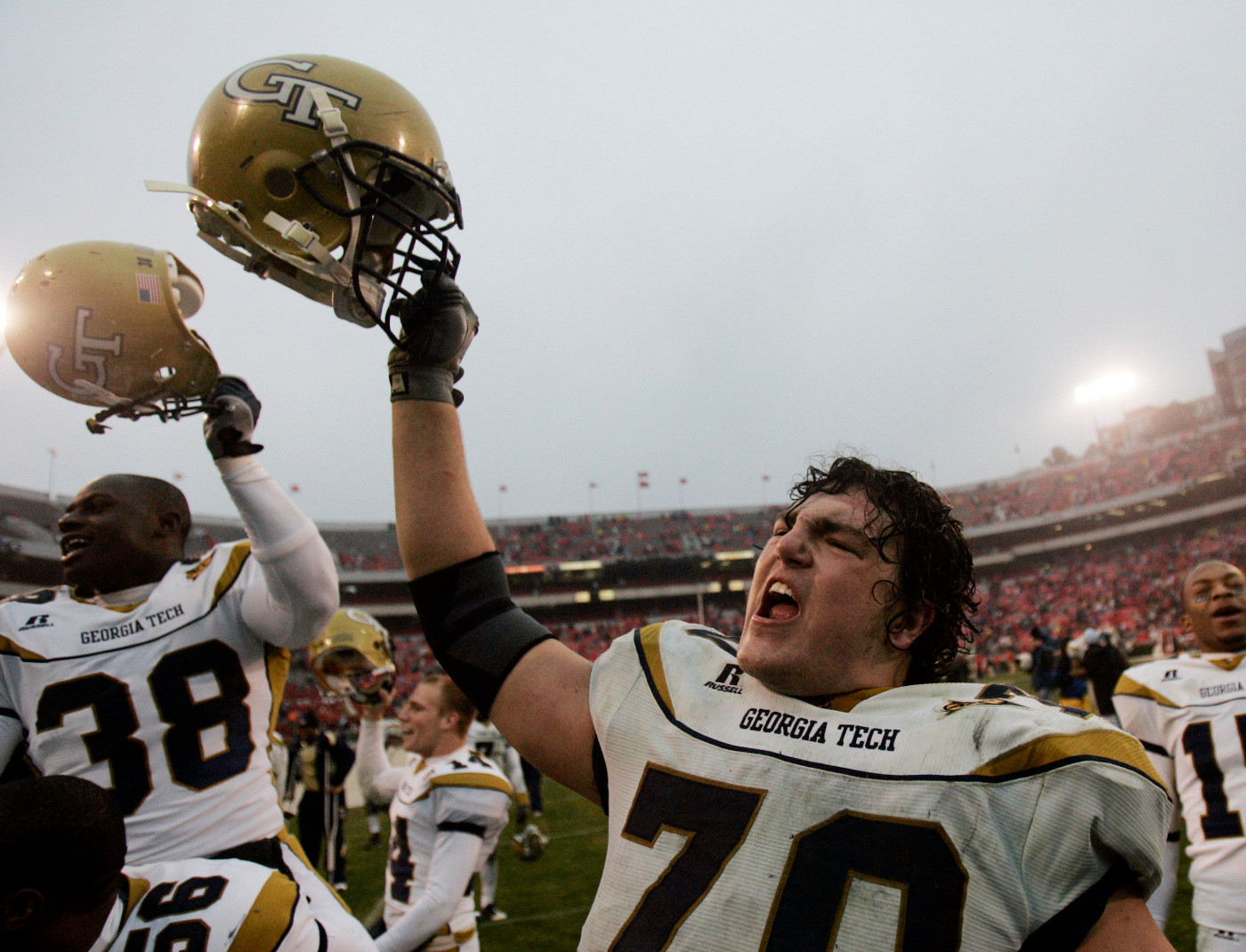 Joseph Gilbert sings the school fight song with his teammates after they defeated Georgia 45-42 in Athens, Ga., , Saturday, Nov. 29, 2008.. (AP Photo/John Bazemore)