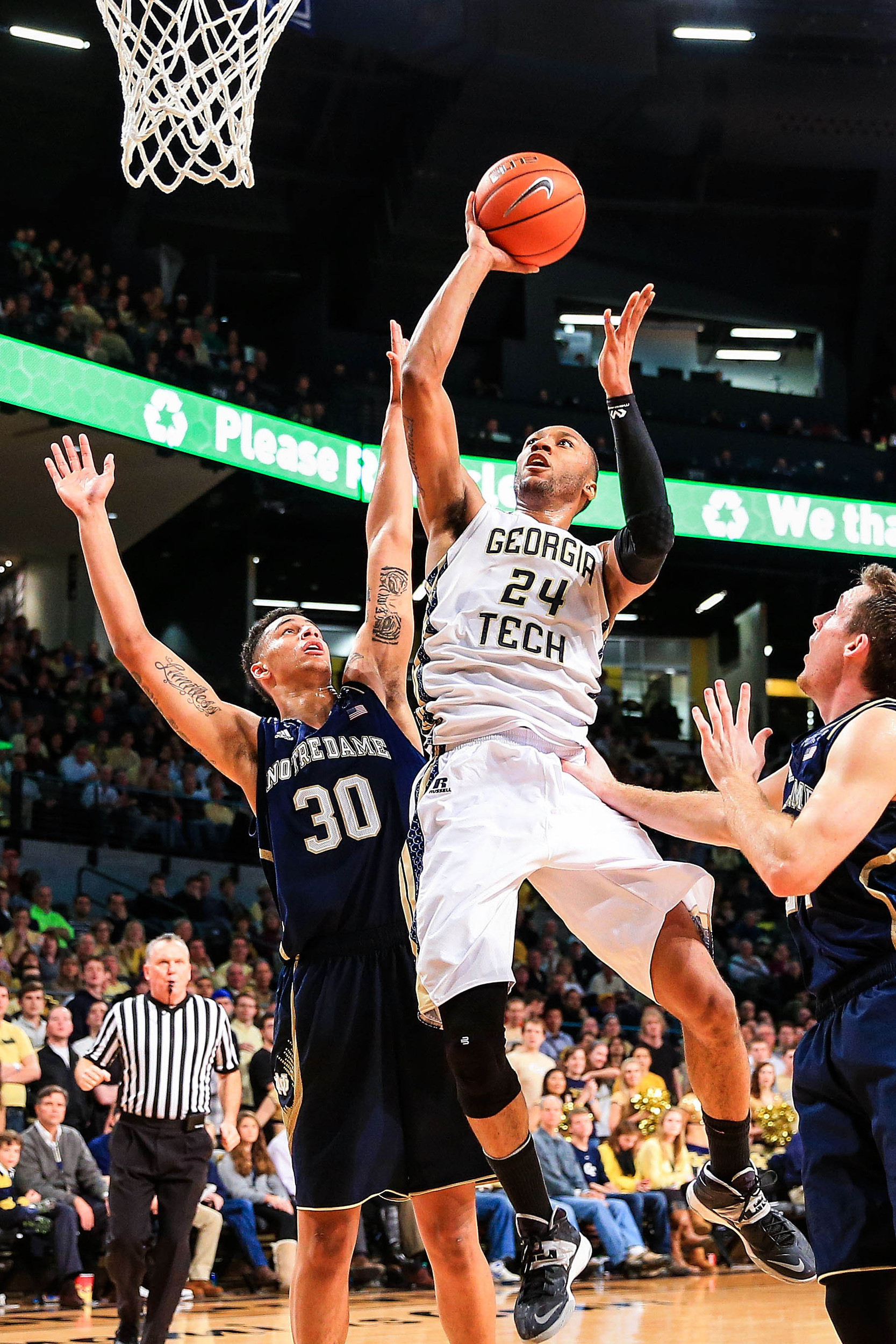 Jan 11, 2014; Atlanta, GA, USA; Georgia Tech Yellow Jackets forward Kammeon Holsey (24) shoots a basket over Notre Dame Fighting Irish forward Zach Auguste (30) in the second half at Hank McCamish Pavilion. Georgia Tech won 74-69. Mandatory Credit: Daniel Shirey-USA TODAY Sports