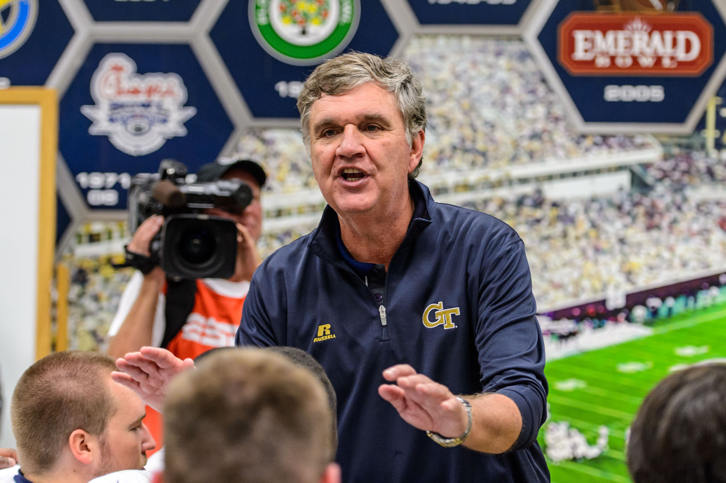 Coach Paul Johnson talks to the team after the upset victory