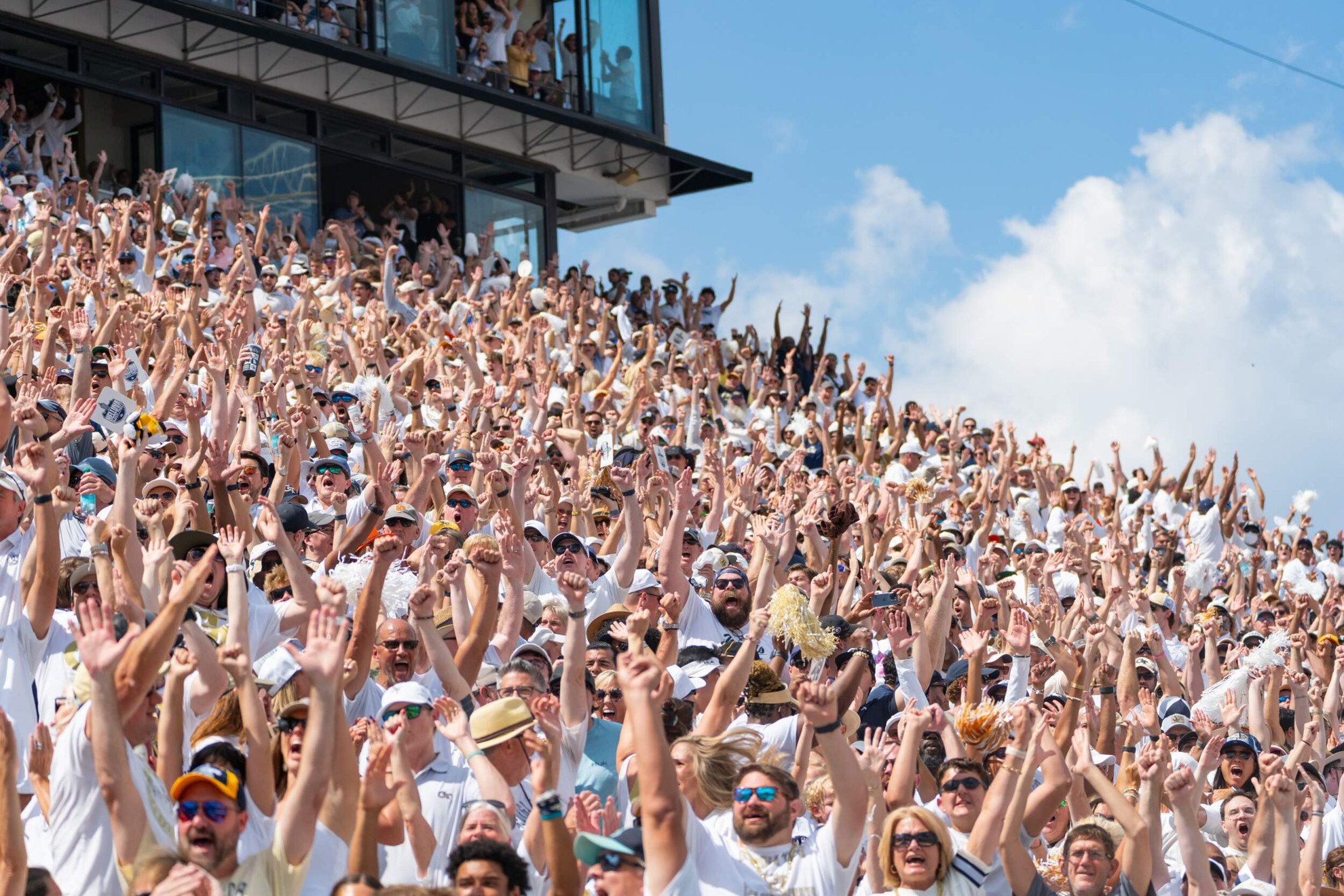 Fans react to a Touchdown during the Georgia Tech Football versus Clemson game at Bobby Dodd Stadium at Hyundai Field in Atlanta, GA.