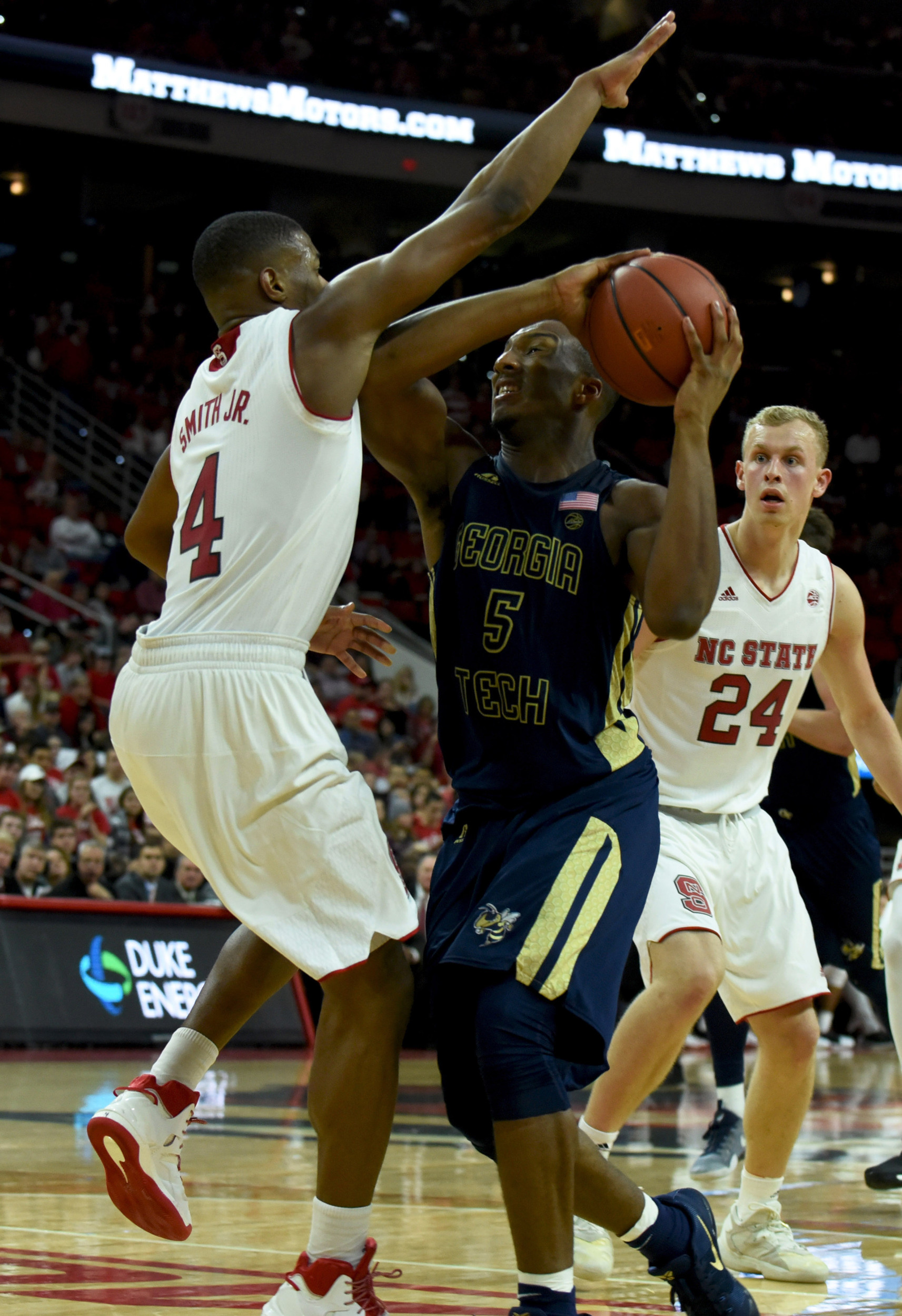 Guard Josh Okogie drives to the basket as North Carolina State Wolfpack guard Dennis Smith Jr. defends during the second half. The Yellow Jackets won 86-76. Credit: Rob Kinnan-USA TODAY Sports
