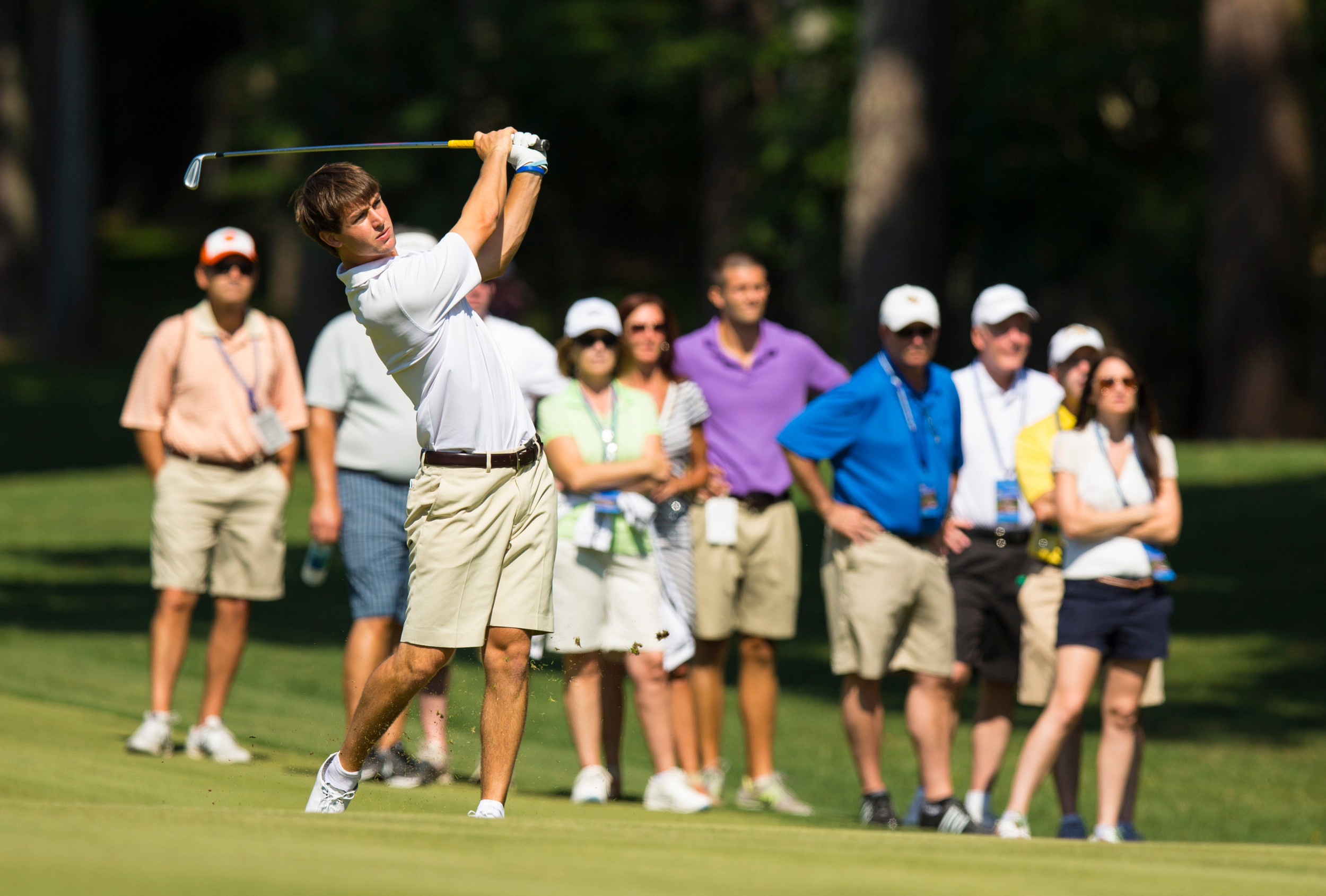 Ollie Schniederjans watches his second shot on the 12th hole during the second round of match play at the 2014 U.S. Amateur at Atlanta Athletic Club in Johns Creek, Ga. on Thursday, Aug. 14, 2014. (Copyright USGA/John Mummert)