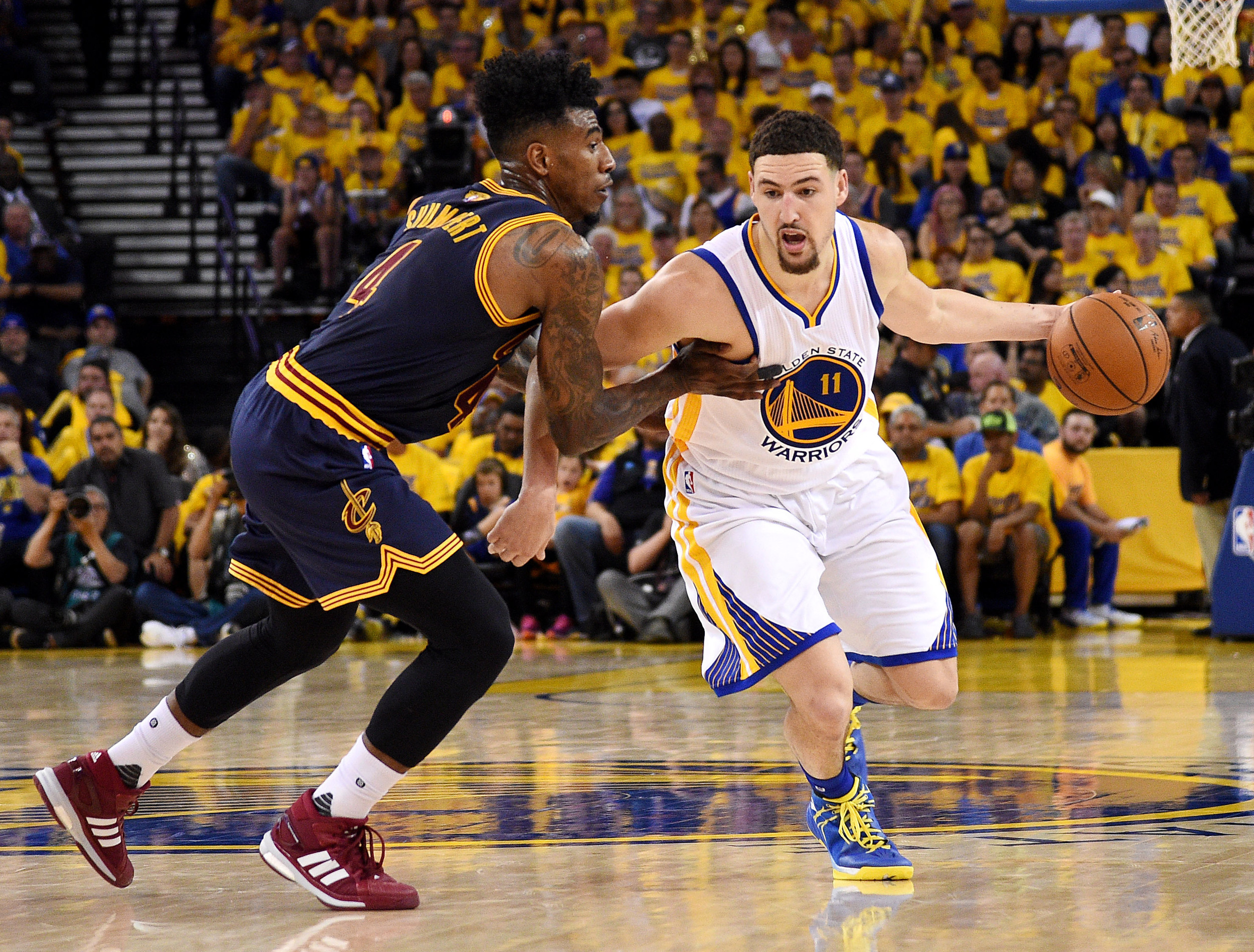 Jun 5, 2016; Oakland, CA, USA; Golden State Warriors guard Klay Thompson (11) drives to the basket against Cleveland Cavaliers guard Iman Shumpert (4) during game two of the NBA Finals. Credit: Kyle Terada-USA TODAY Sports