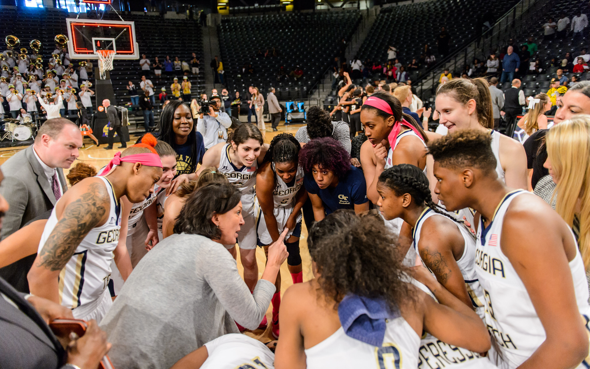Coach Jo speaks to the team after the win