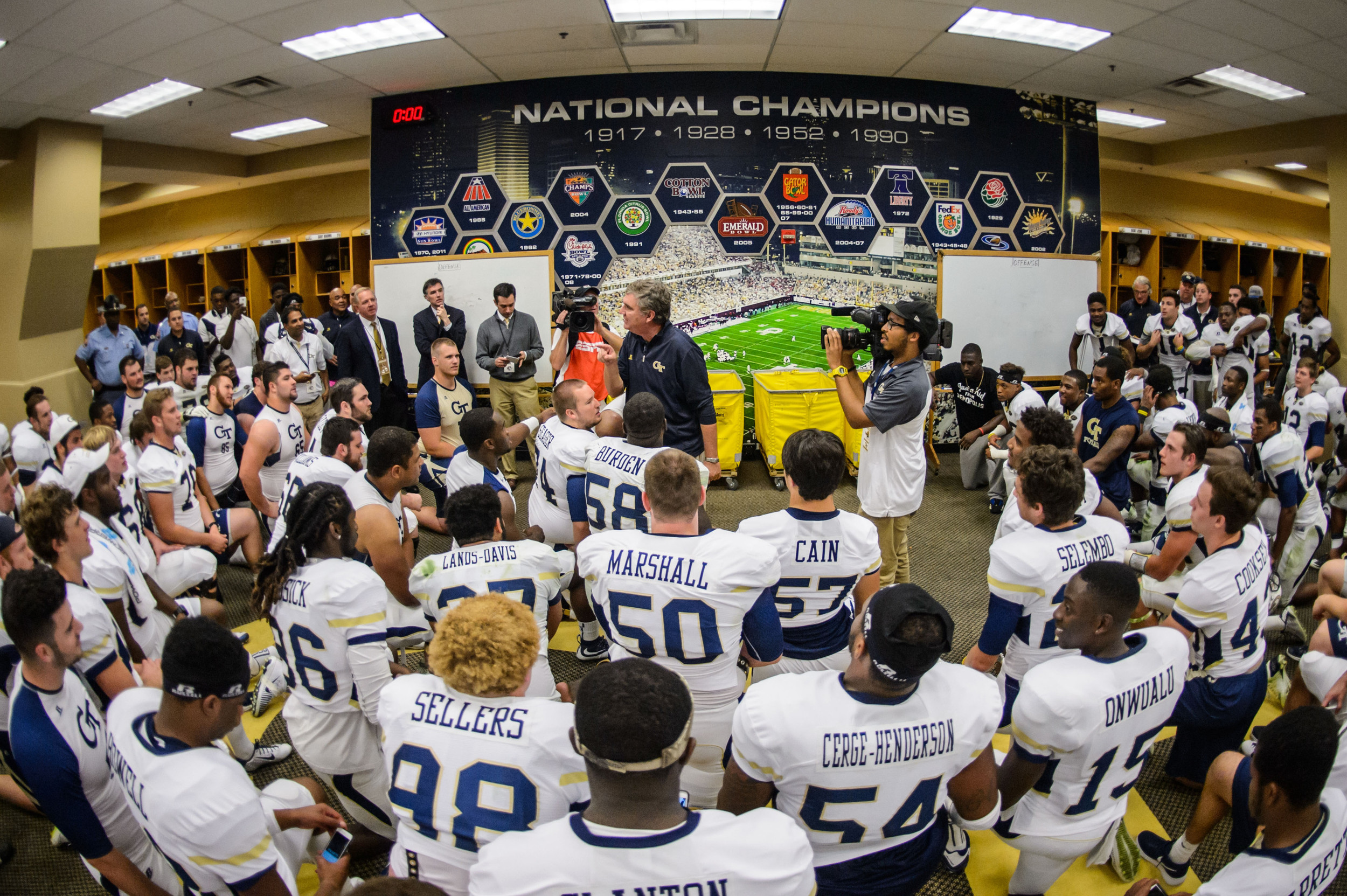 Coach Paul Johnson talks to the team after the upset victory