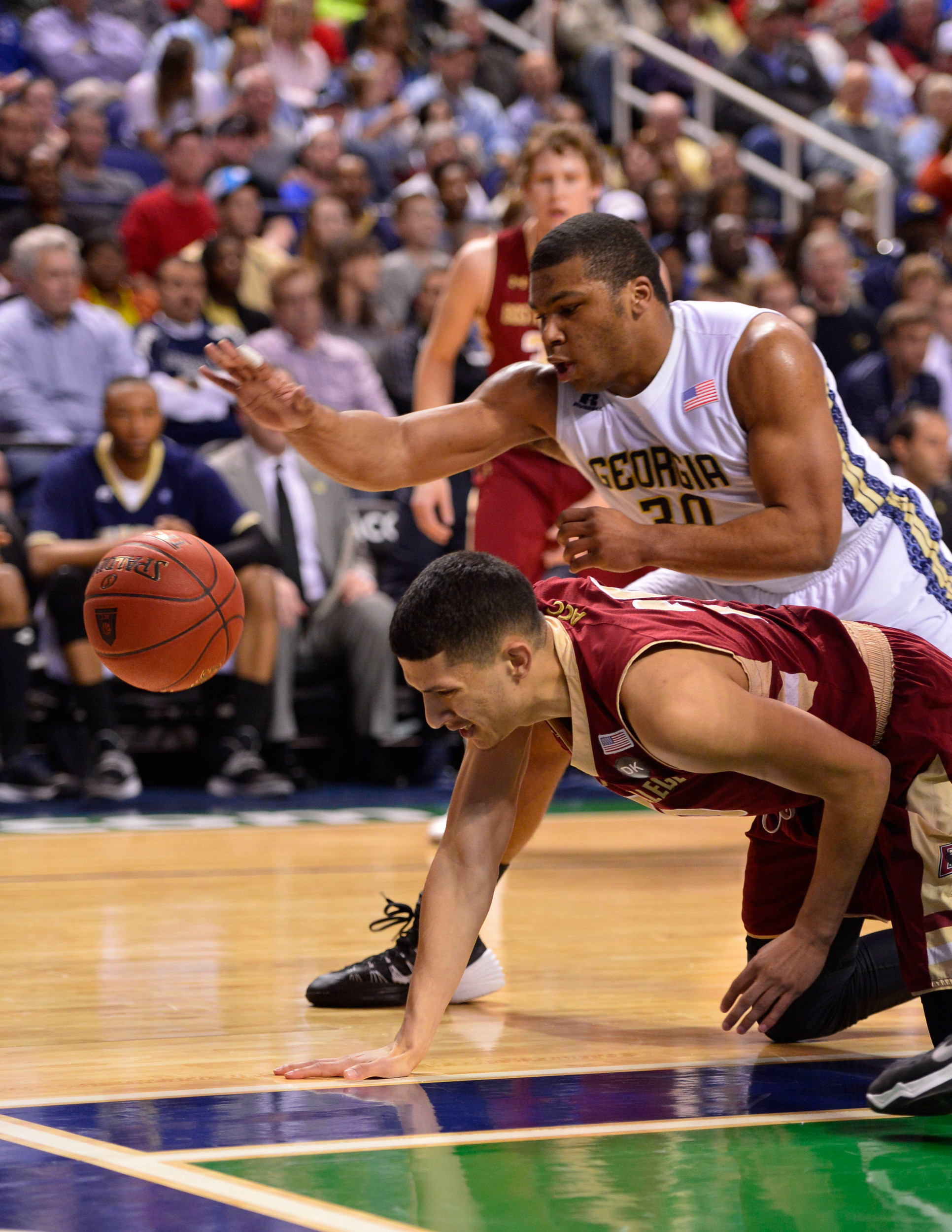 Mar 12, 2014; Greensboro, NC, USA; Georgia Tech Yellow Jackets guard Corey Heyward (30) and Boston College Eagles guard Lonnie Jackson (20) fight for the ball in the first half in the first round at Greensboro Coliseum. Mandatory Credit: Bob Donnan-USA TODAY Sports